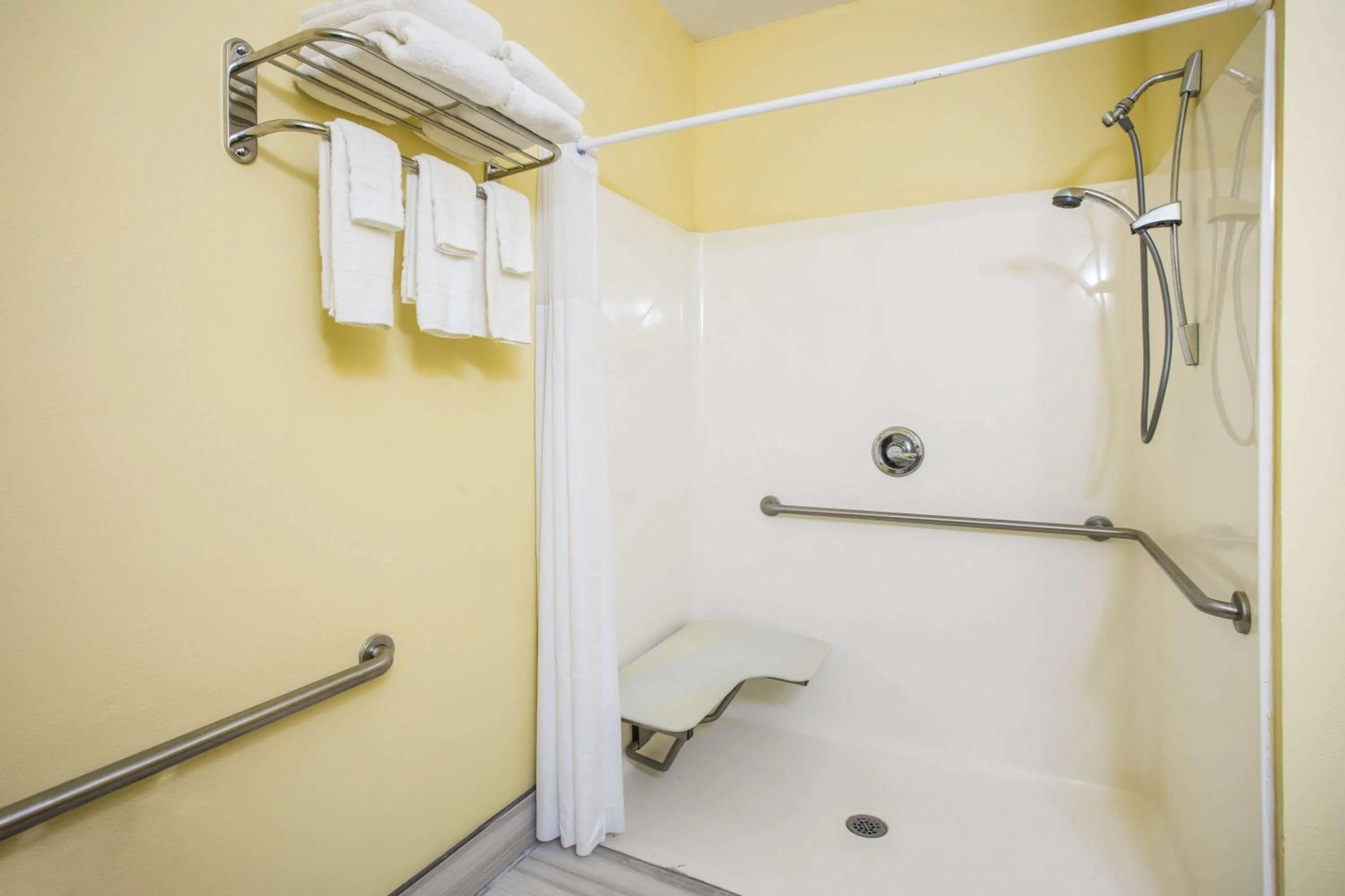 Bathroom in Days Inn & Suites by Wyndham Augusta Near Fort Eisenhower