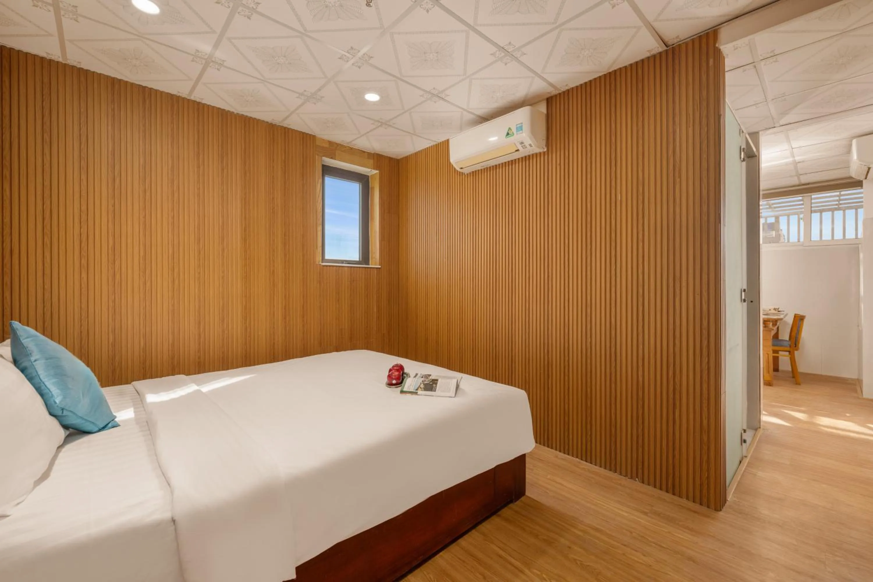 Bed in Maxhome Luxury Hotel