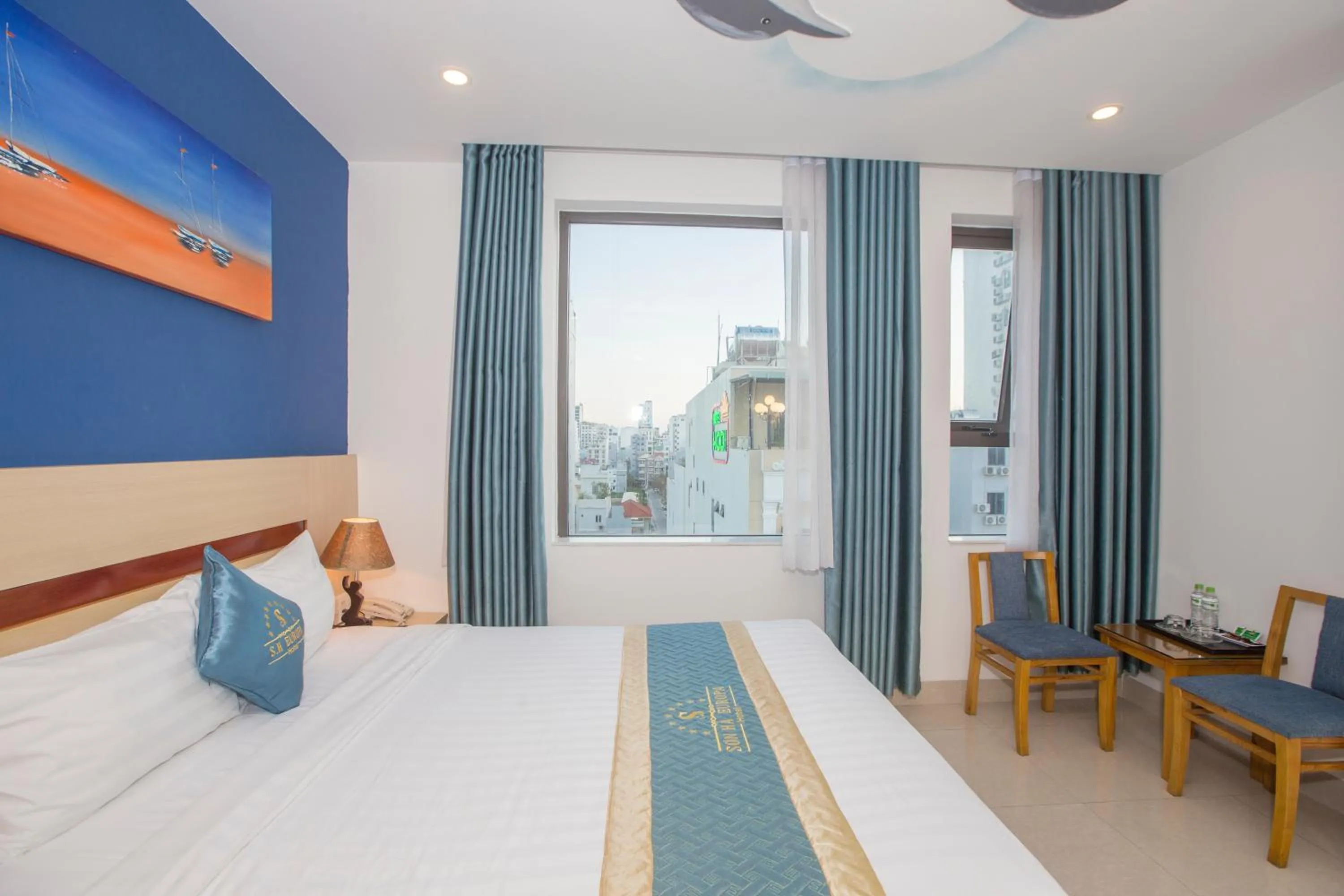 Bed in Maxhome Luxury Hotel