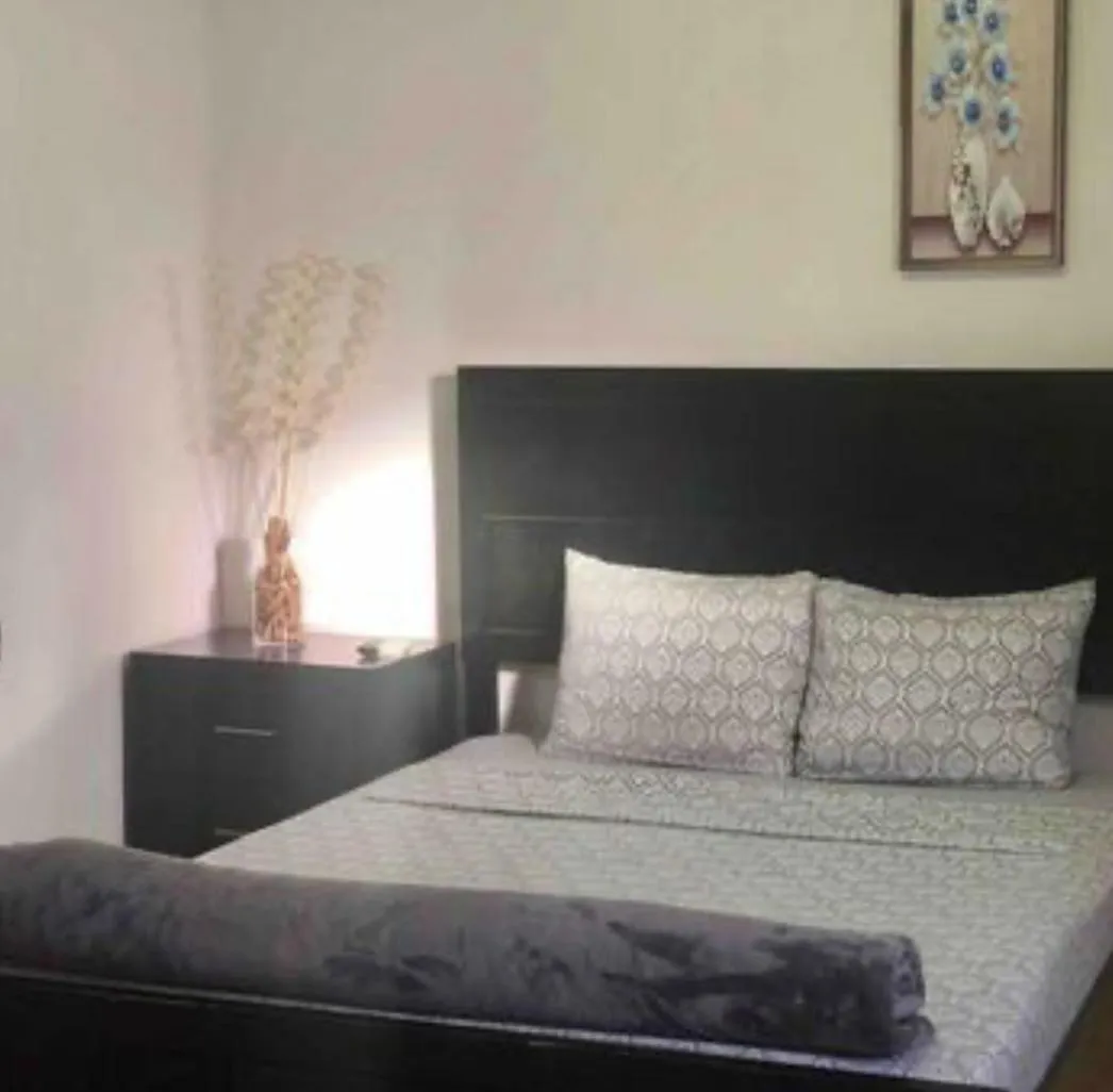 Bed in Genesis Apartments