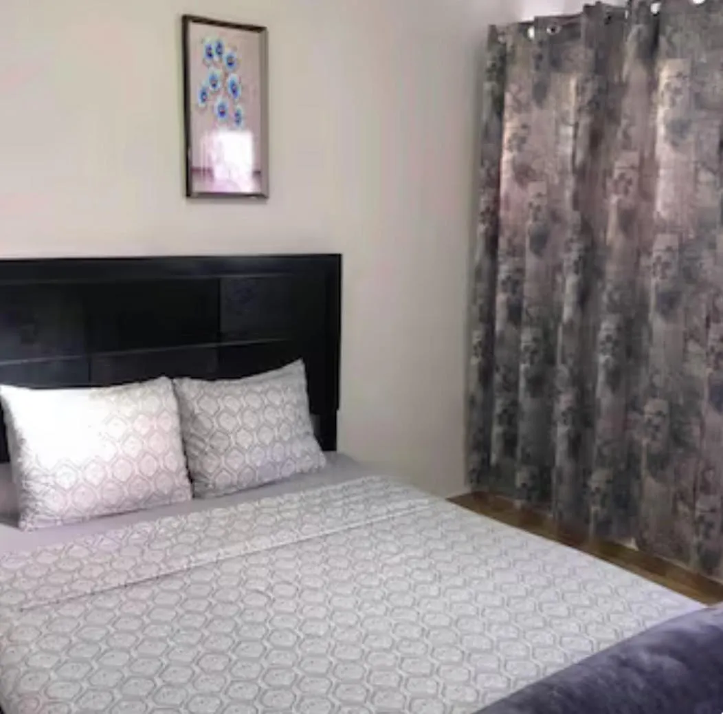 Bed in Genesis Apartments