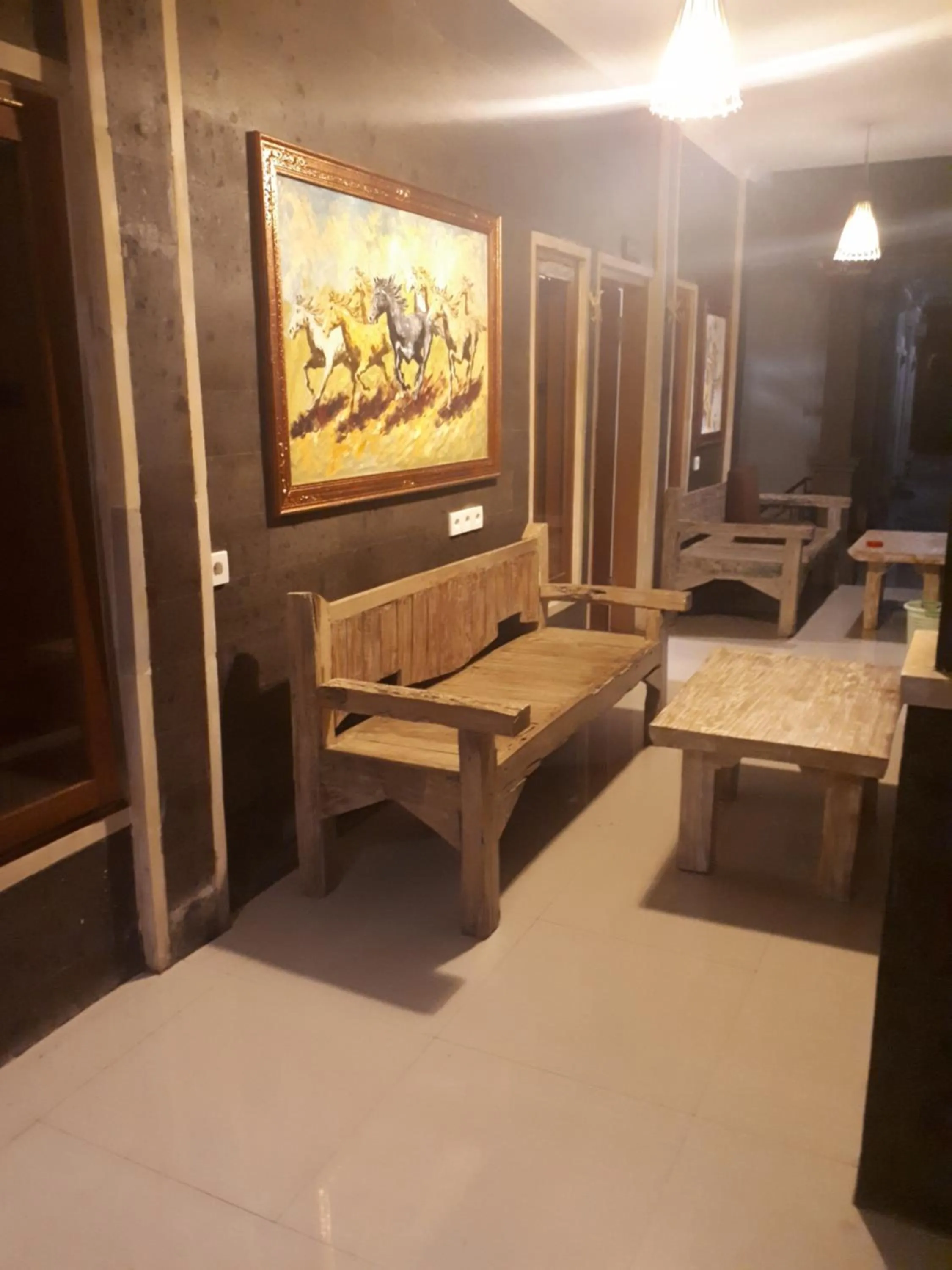 Communal lounge/ TV room in New Ubud Hostel