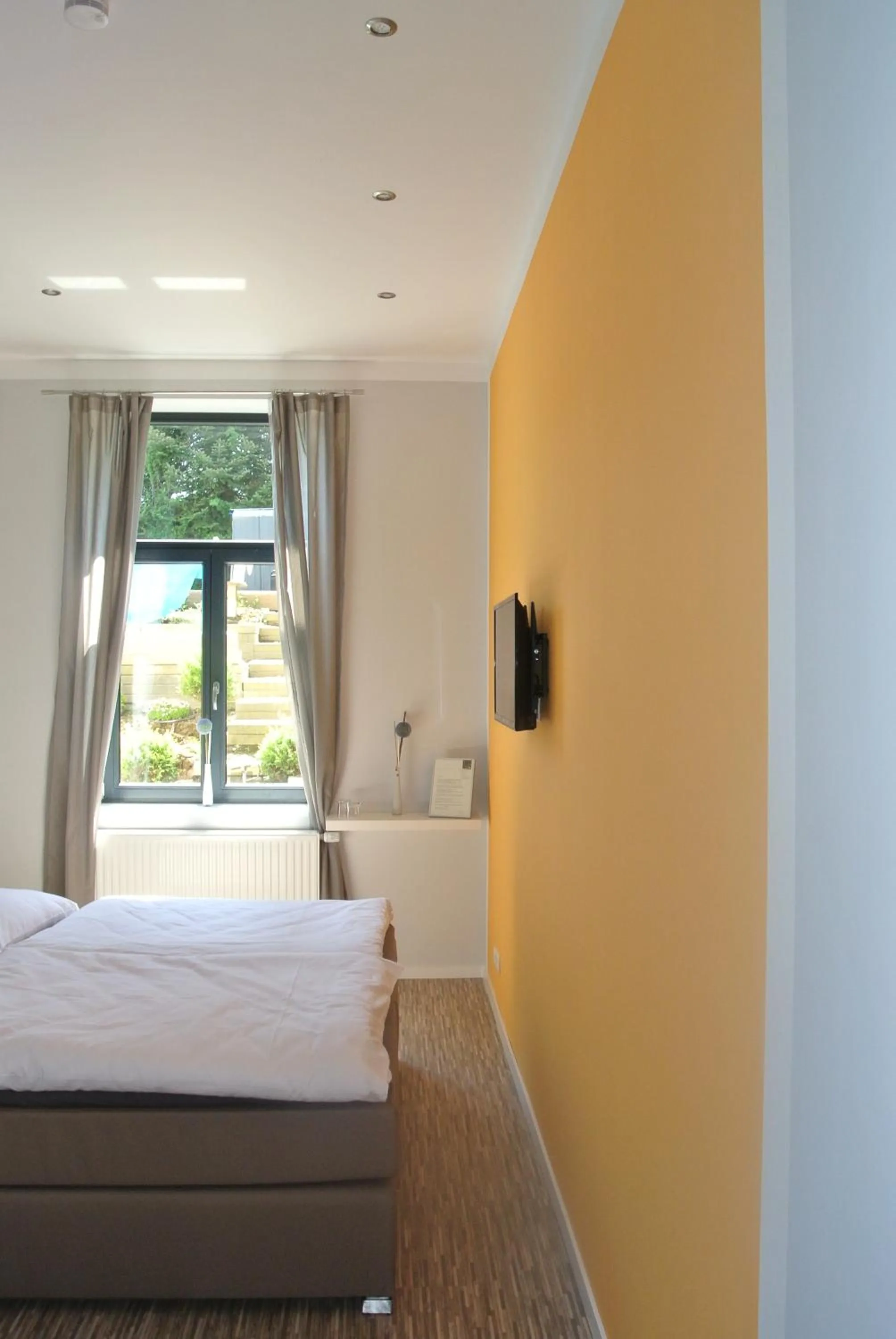 Bed in Gästehaus Tappes Hofgarten