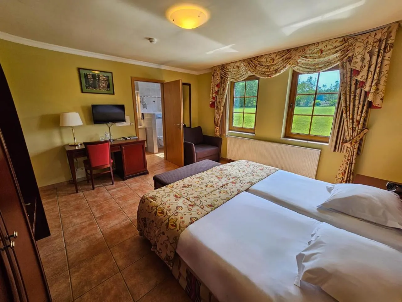 Bed in Logis Hôtel Le Menobu