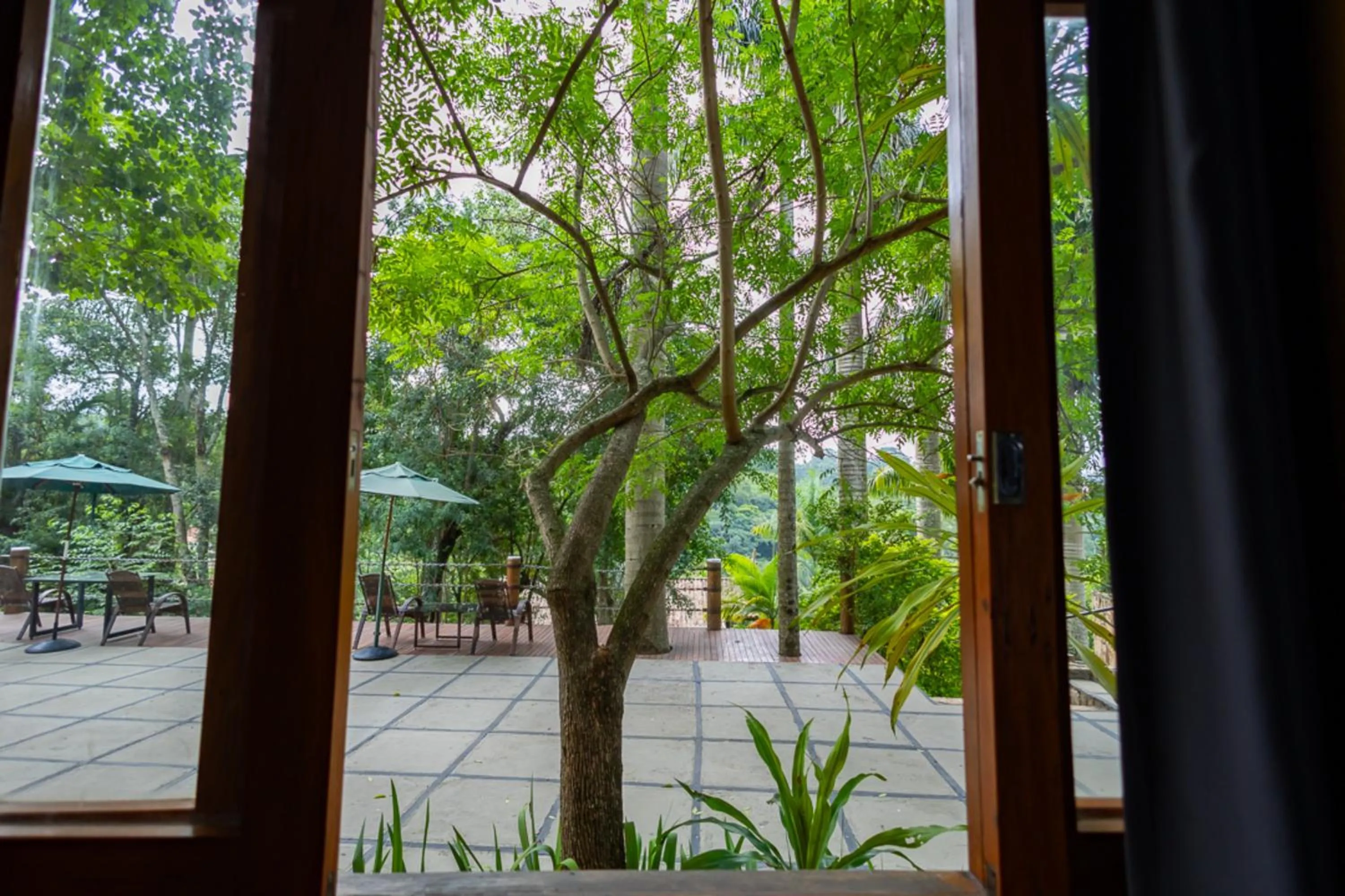 Garden view in Putini Pousada e Hotel by OYO