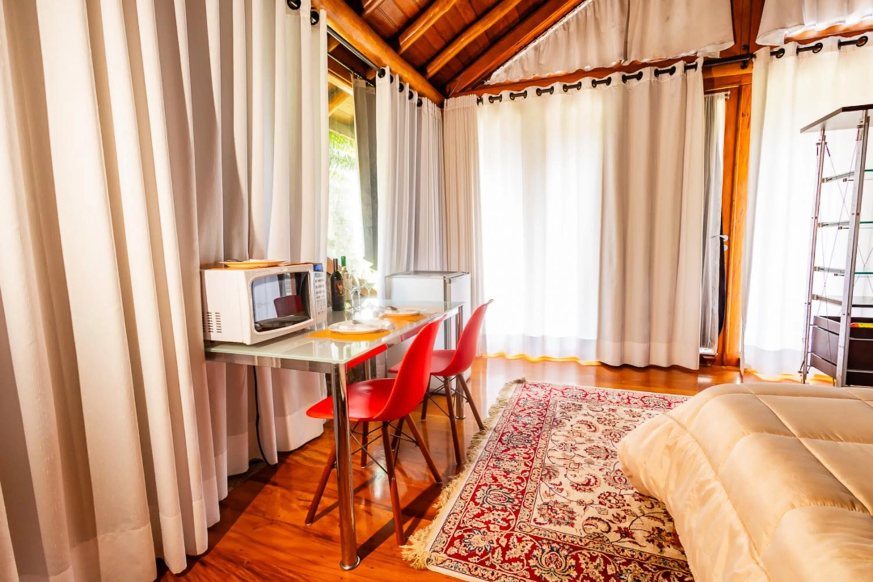 Bedroom in Putini Pousada e Hotel by OYO