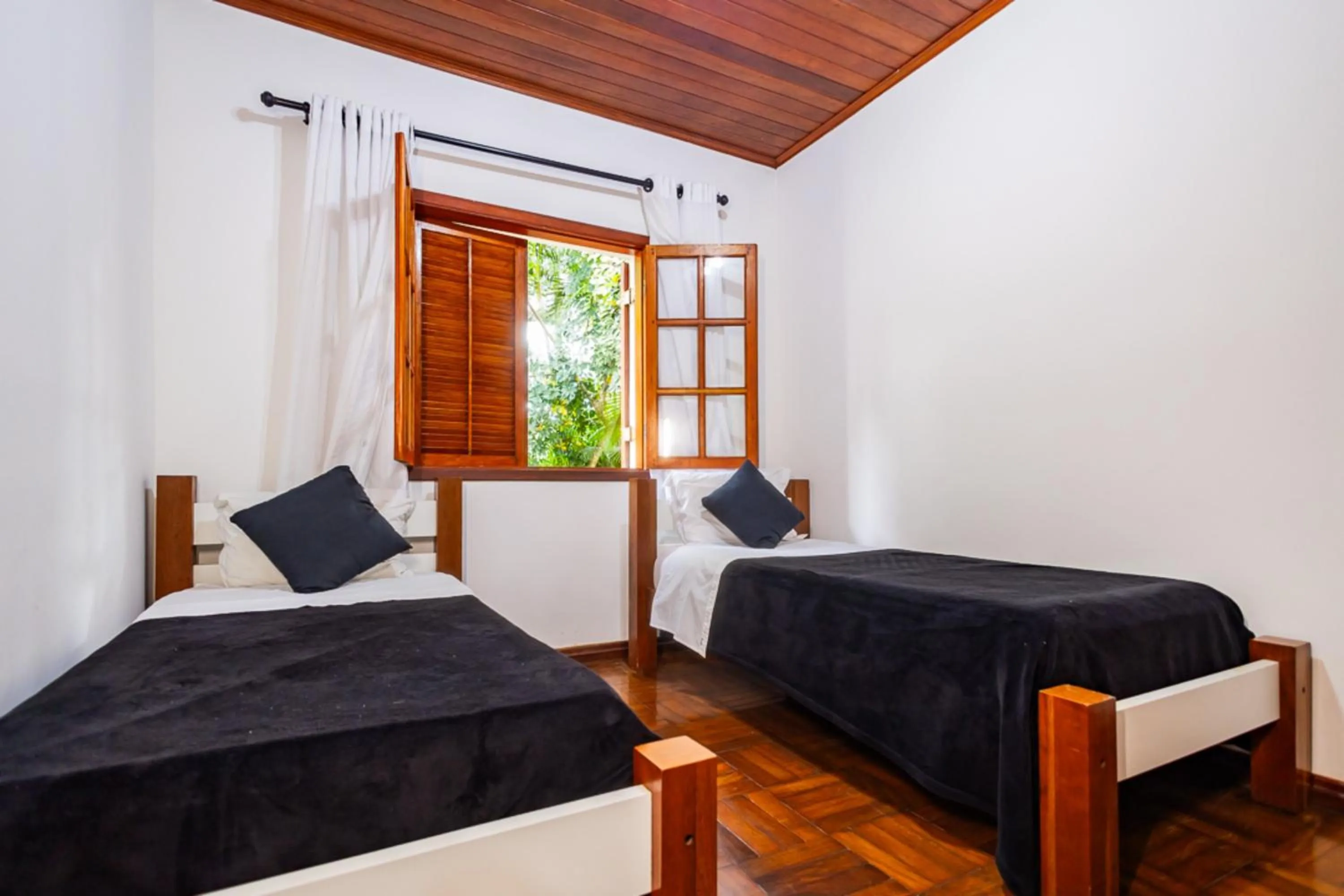 Bedroom, Bed in Putini Pousada e Hotel by OYO