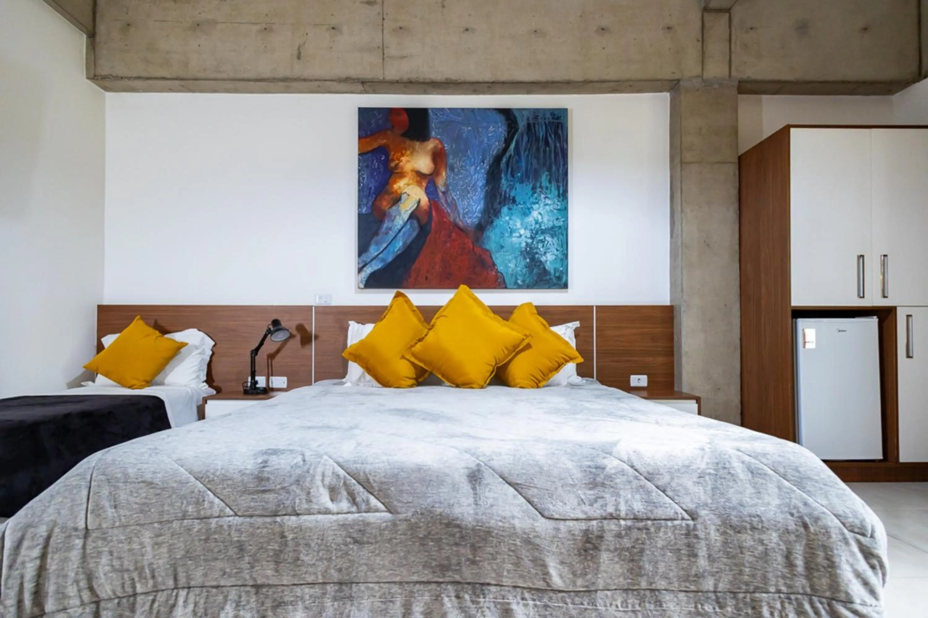 Bedroom, Bed in Putini Pousada e Hotel by OYO