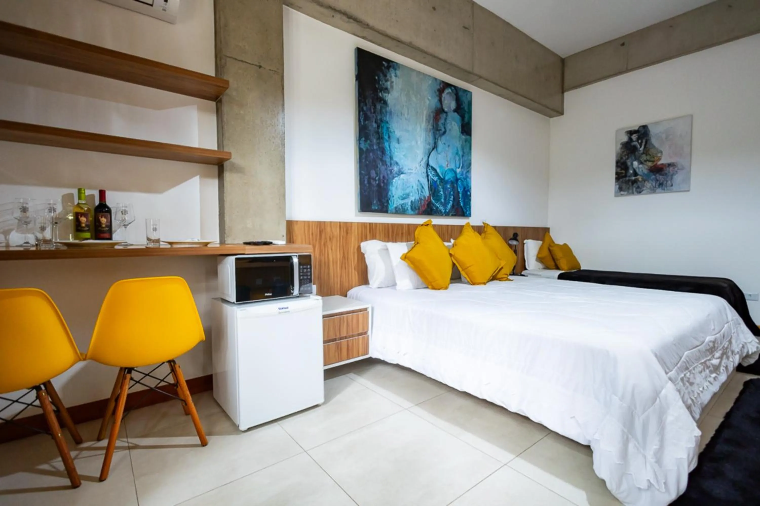 Bedroom, Bed in Putini Pousada e Hotel by OYO