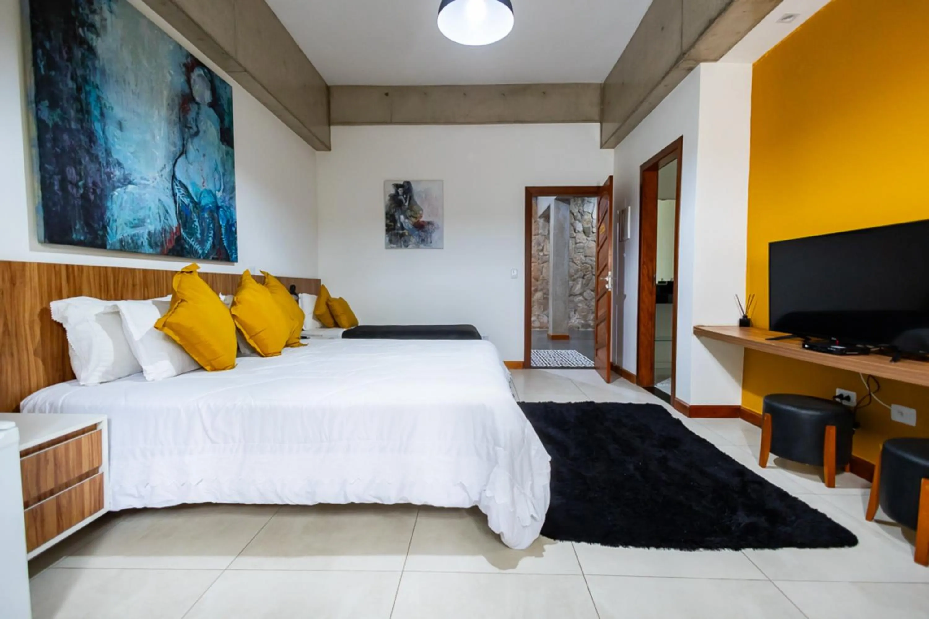 Bedroom, Bed in Putini Pousada e Hotel by OYO