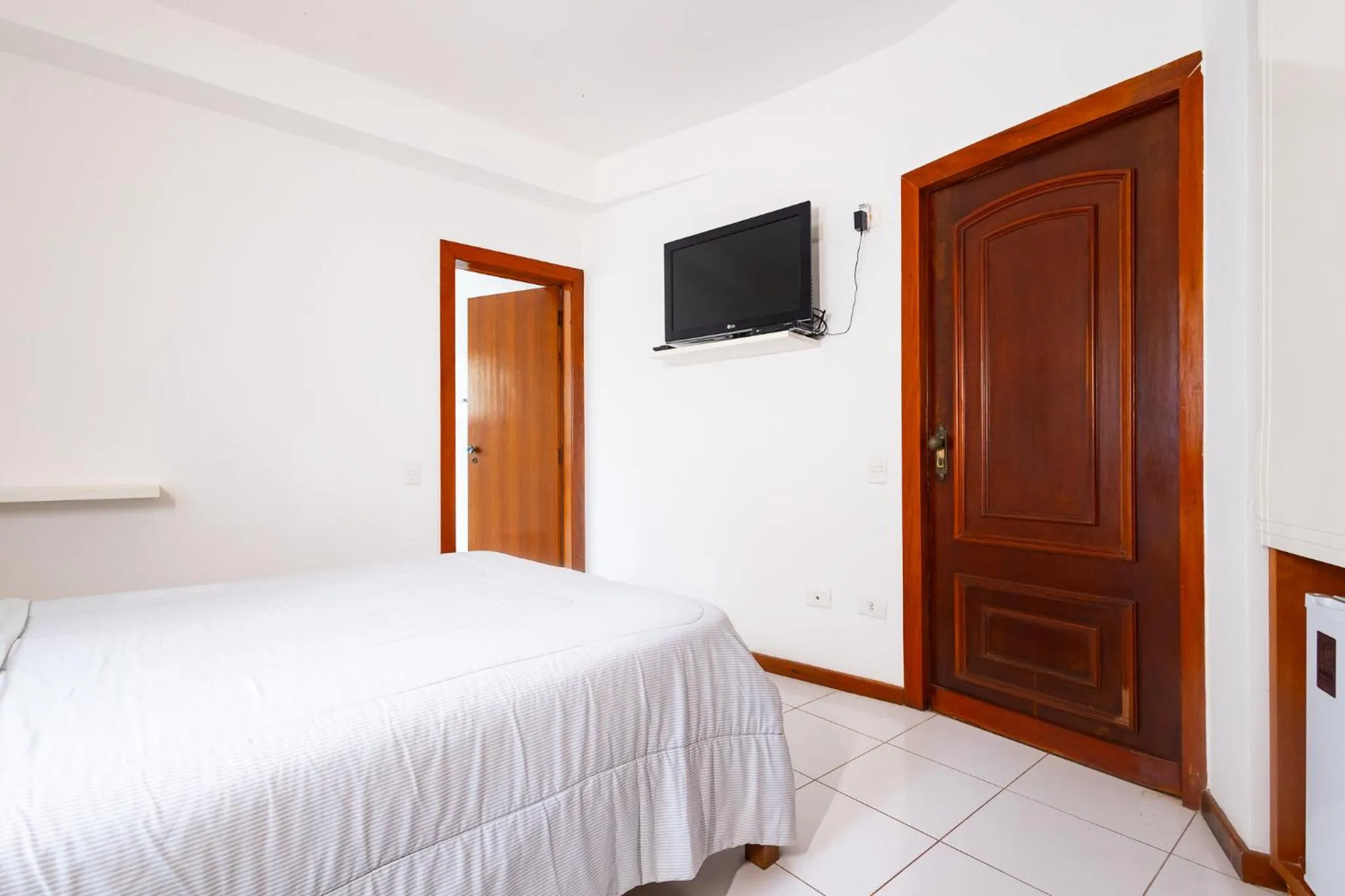 Bedroom, Bed in Putini Pousada e Hotel by OYO