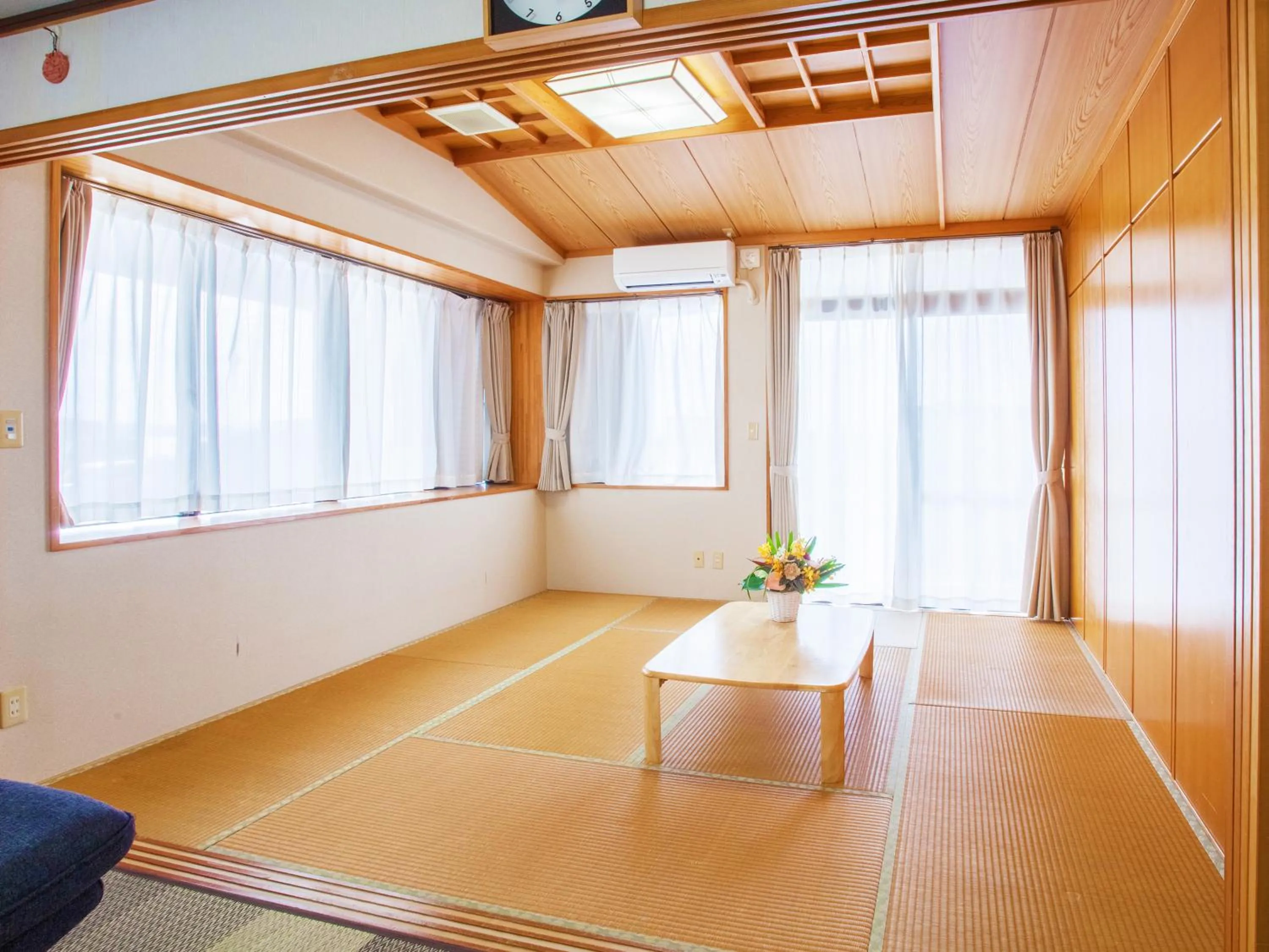 Bedroom in Kariyushi Condominium Resort Sea Side House