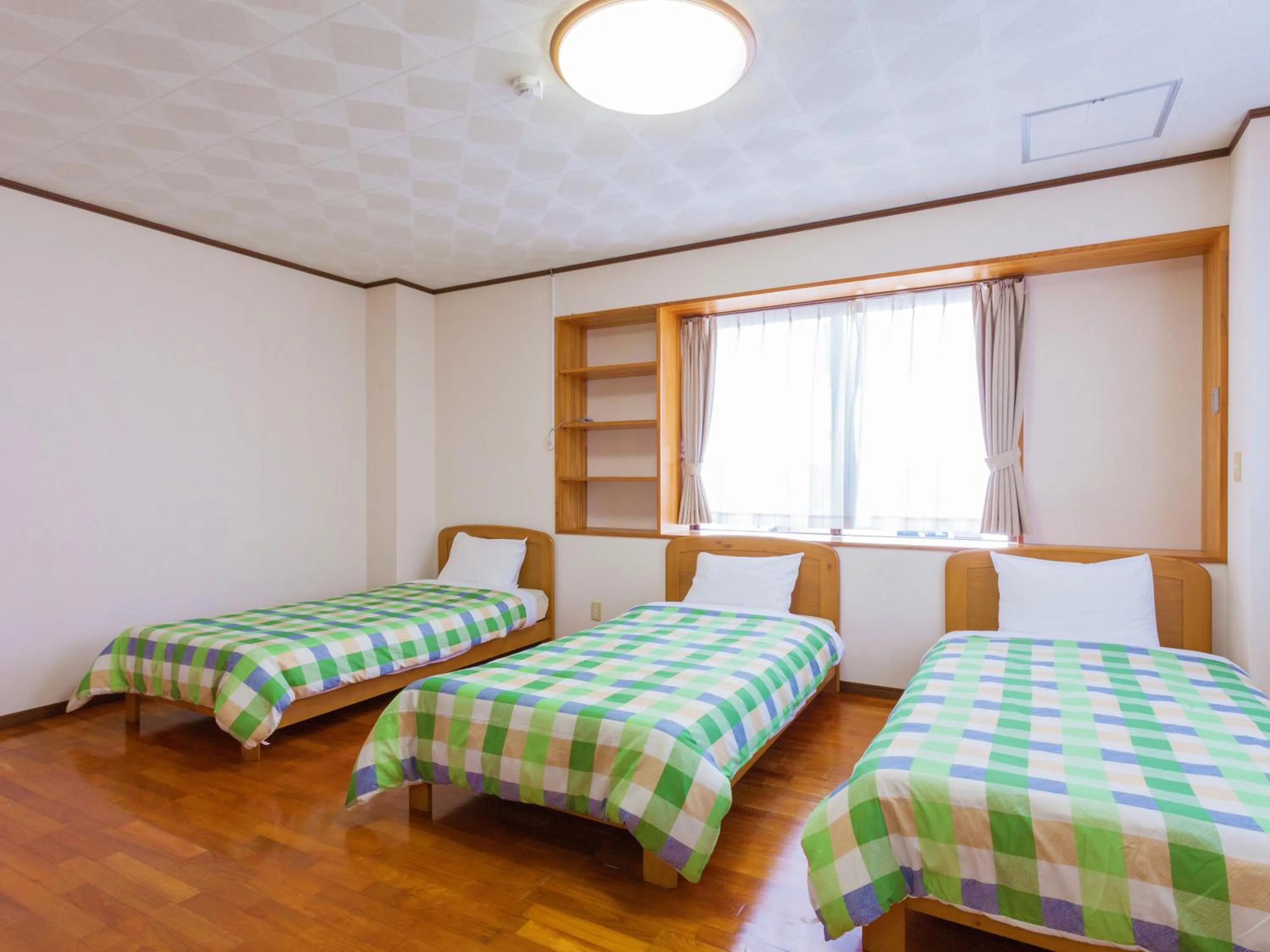Bedroom, Bed in Kariyushi Condominium Resort Sea Side House