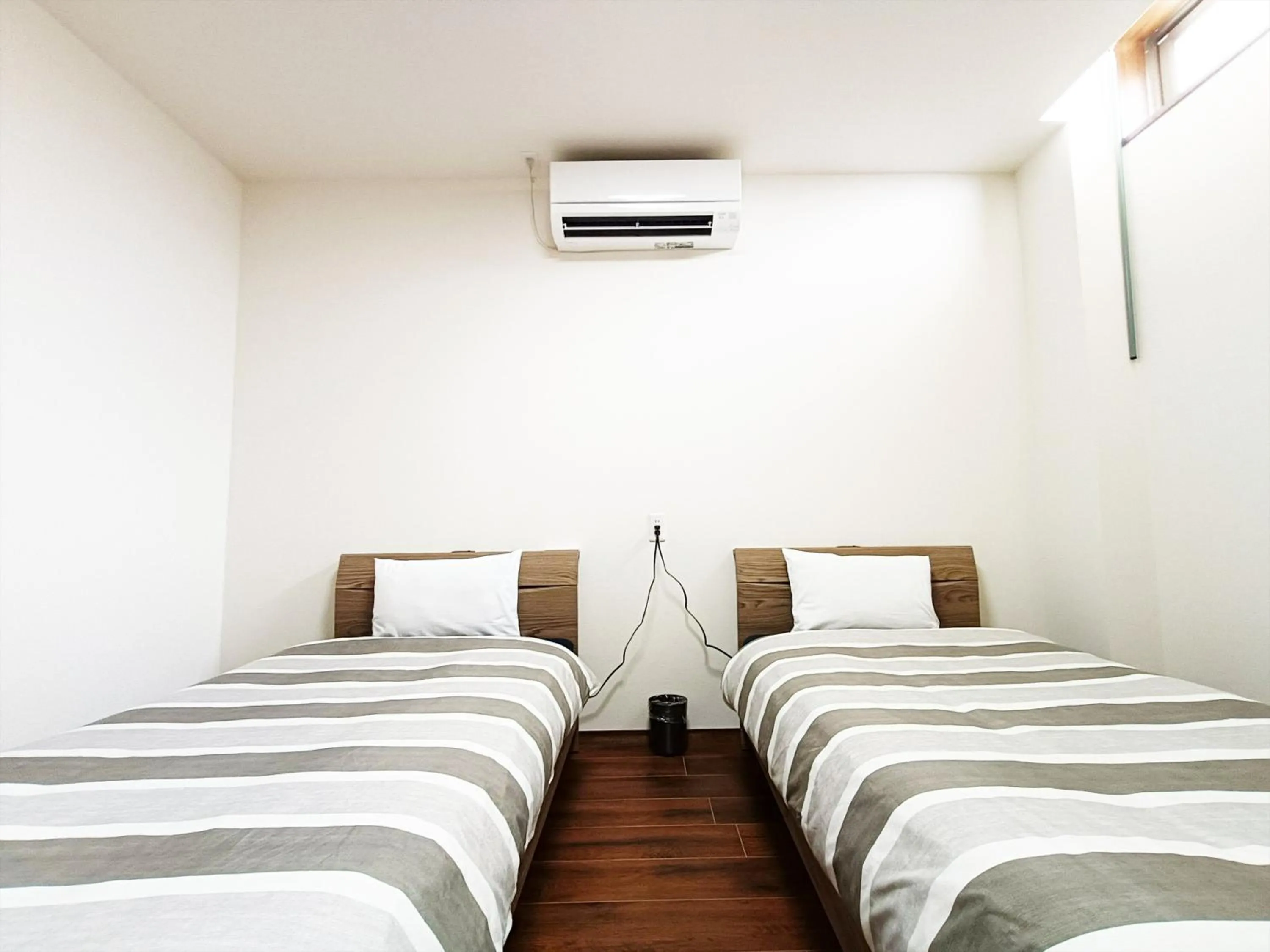 Photo of the whole room, Bed in Kariyushi Condominium Resort Sea Side House