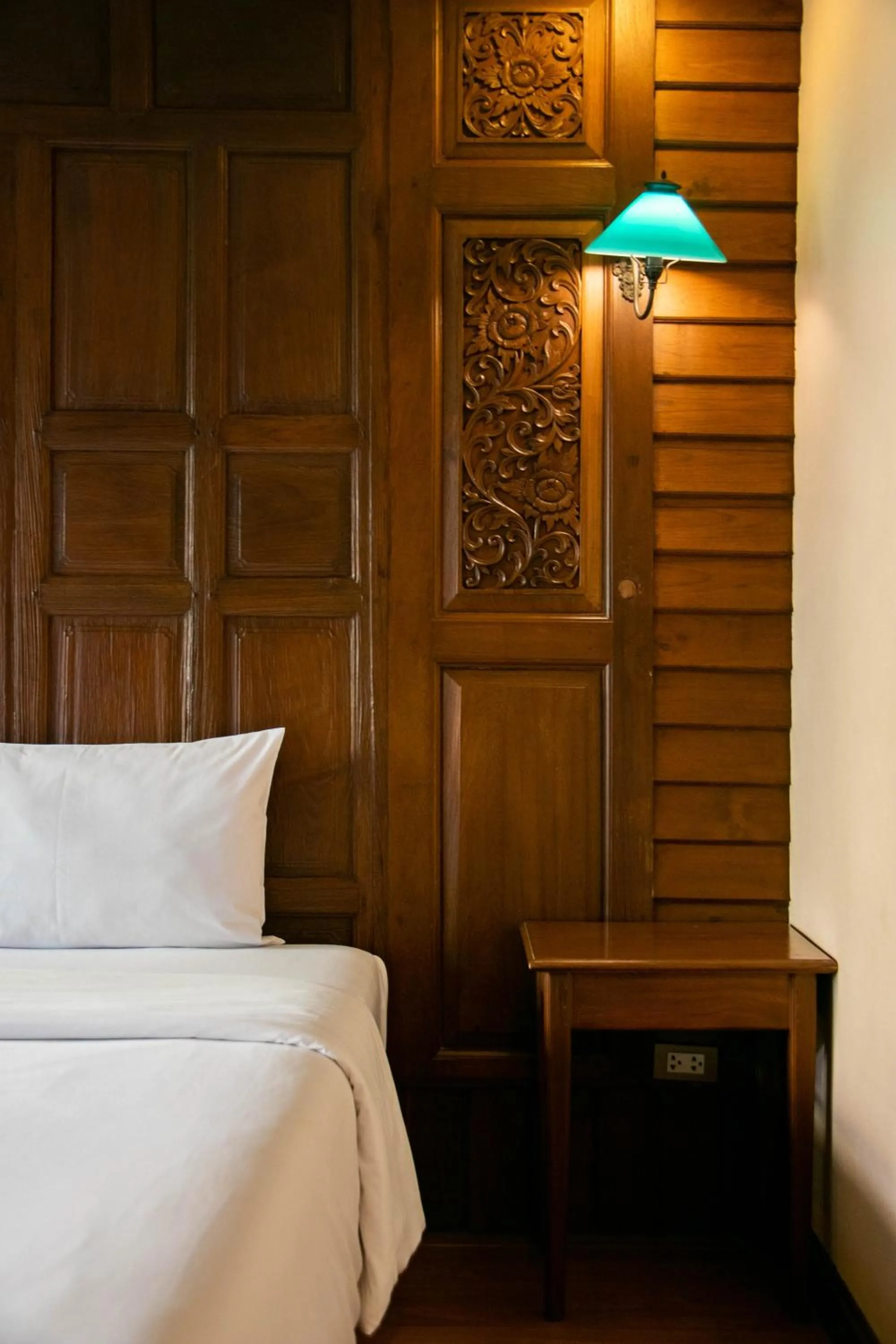 Bed in Lamphu Tree House Boutique Hotel