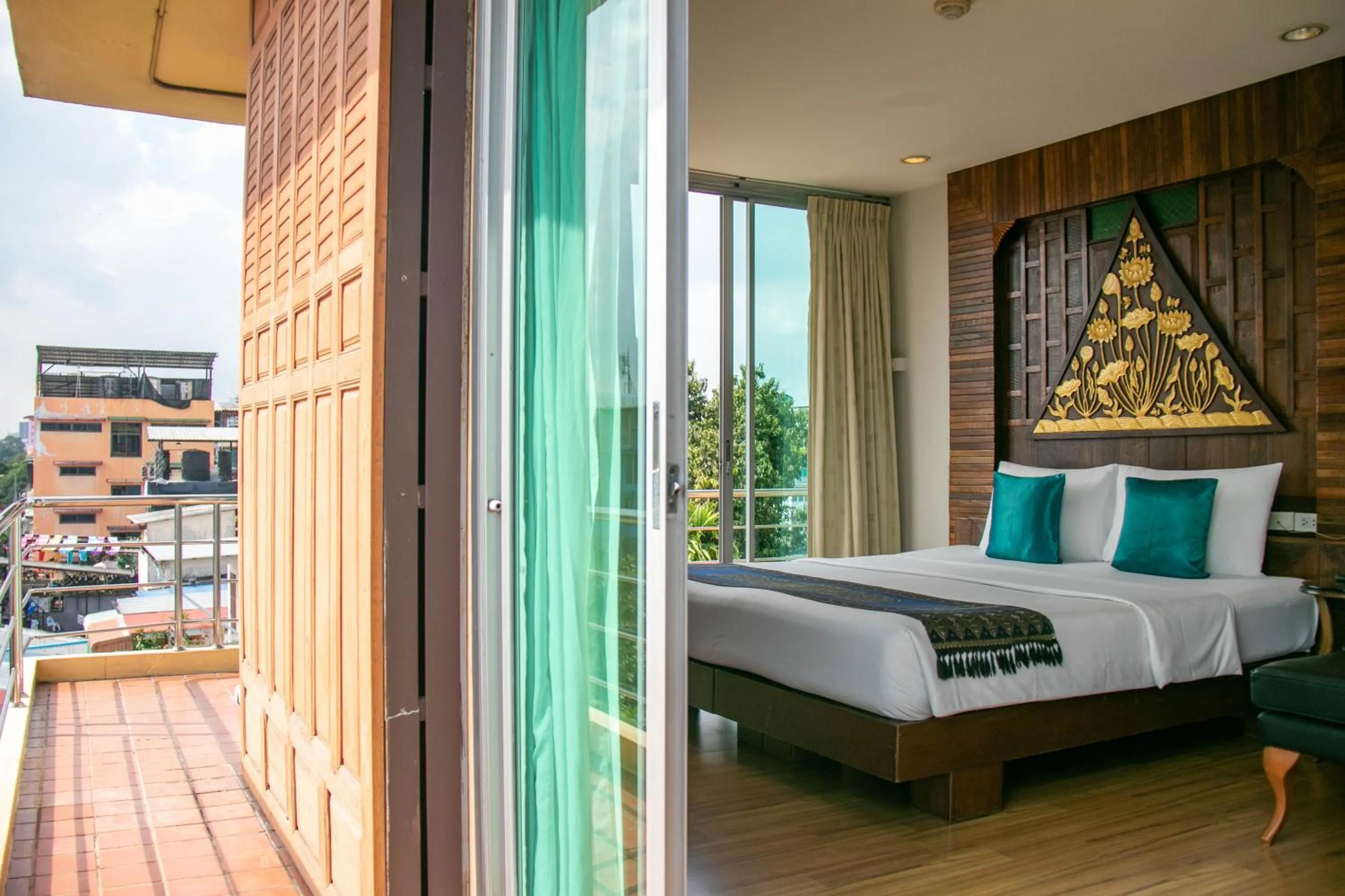 Bed in Lamphu Tree House Boutique Hotel
