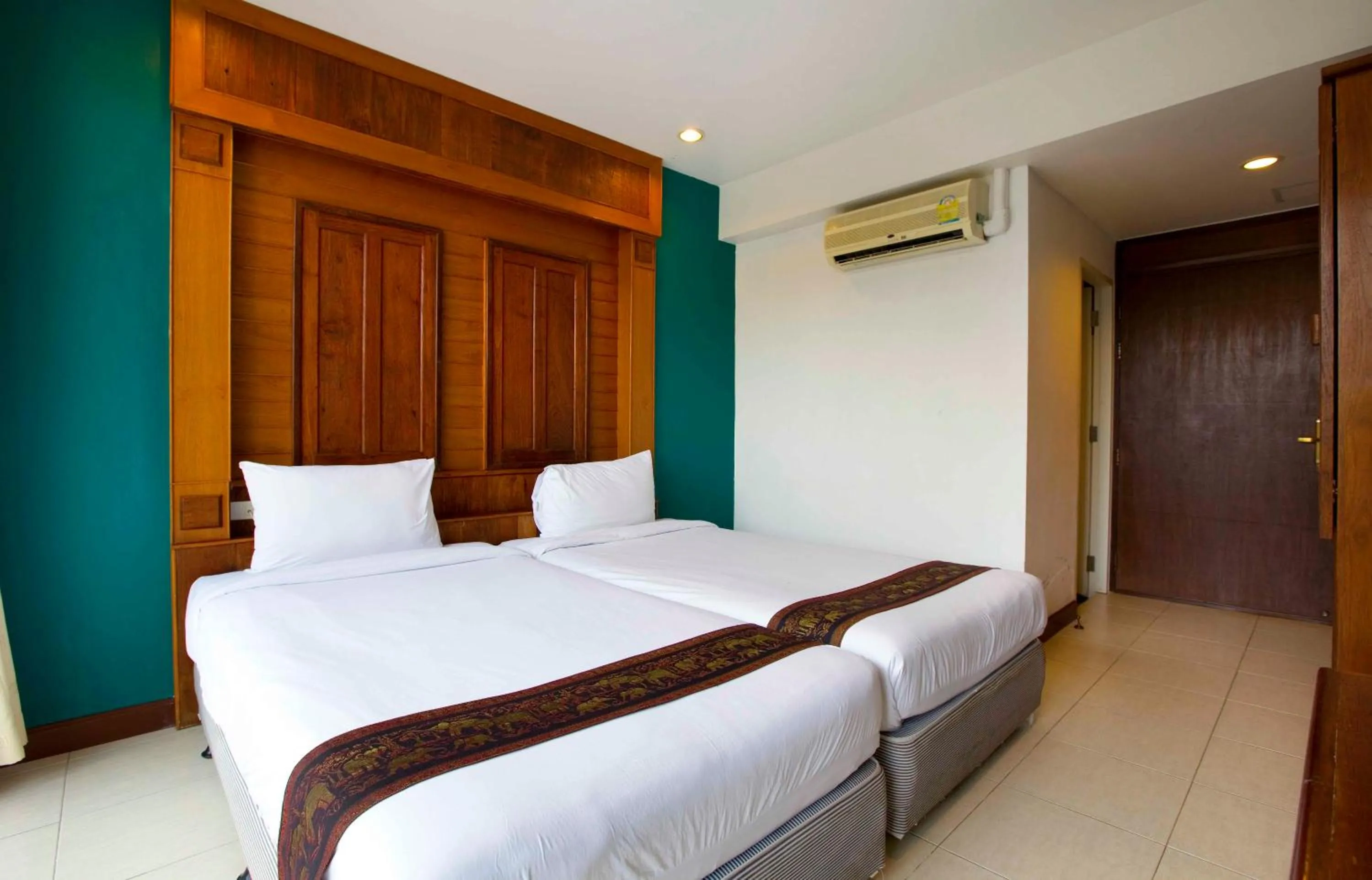 Bed in Lamphu Tree House Boutique Hotel