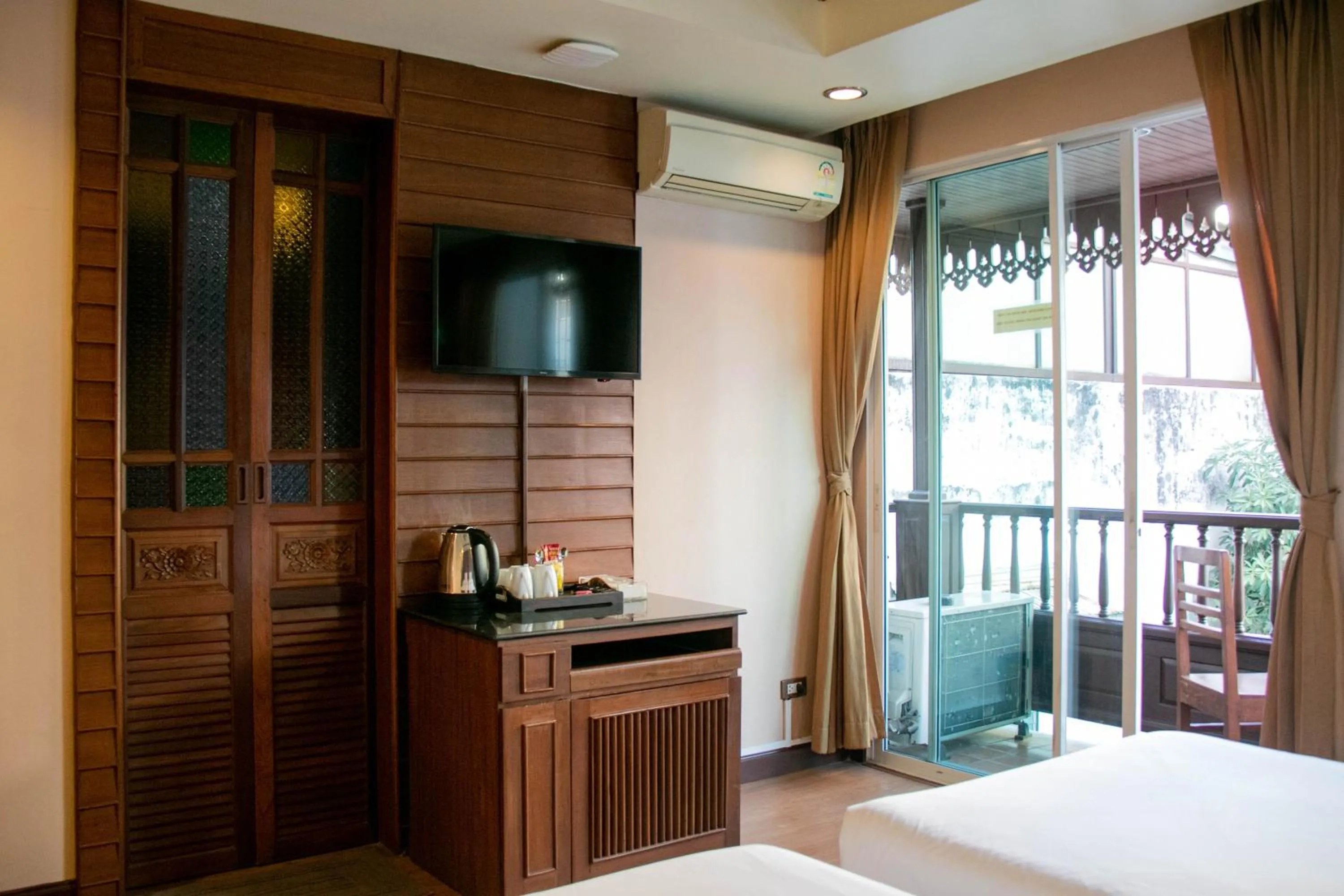 Photo of the whole room, Bed in Lamphu Tree House Boutique Hotel