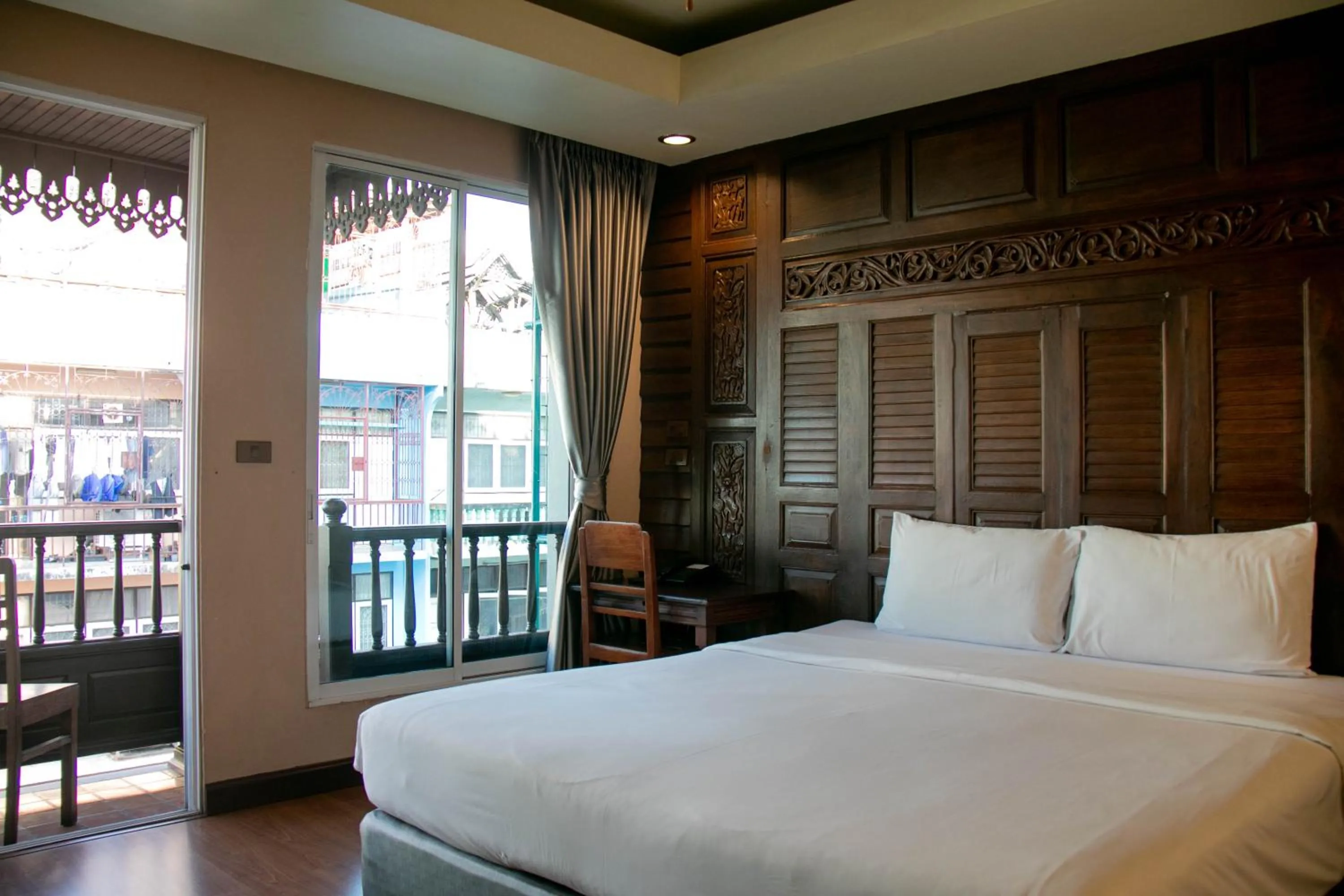 Bed in Lamphu Tree House Boutique Hotel