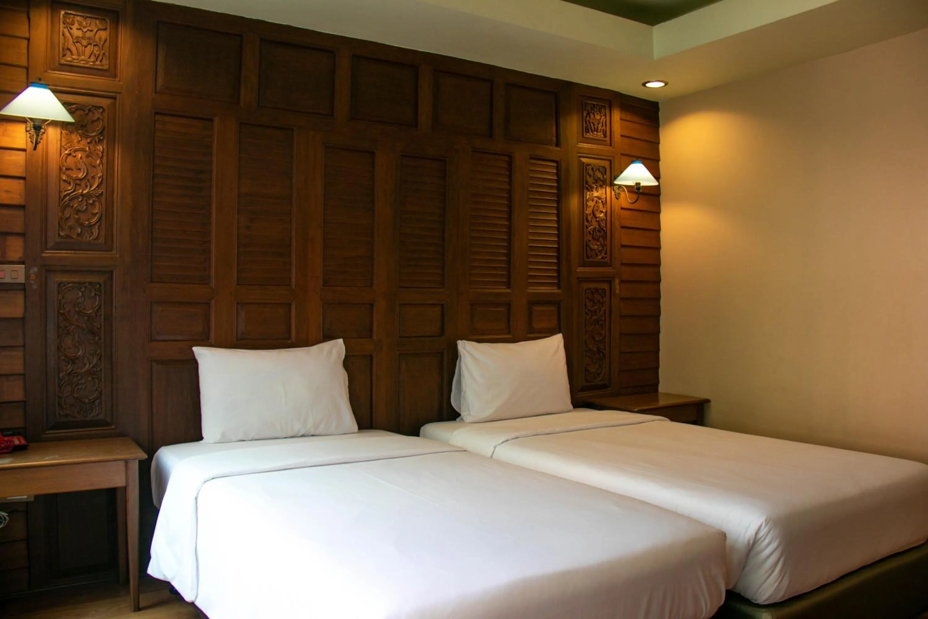 Bed in Lamphu Tree House Boutique Hotel