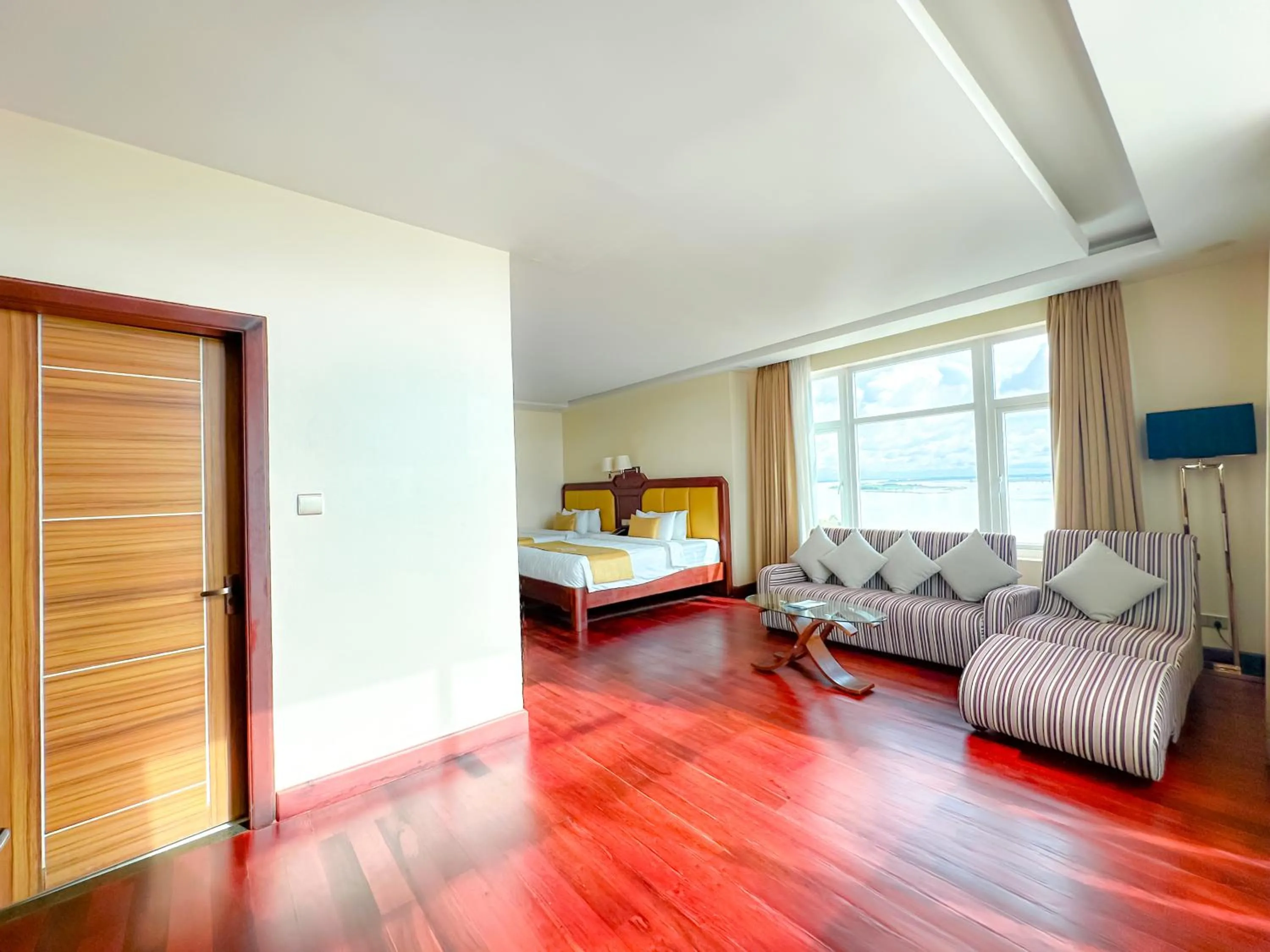 Seating area, Bed in Lbn Asian Hotel