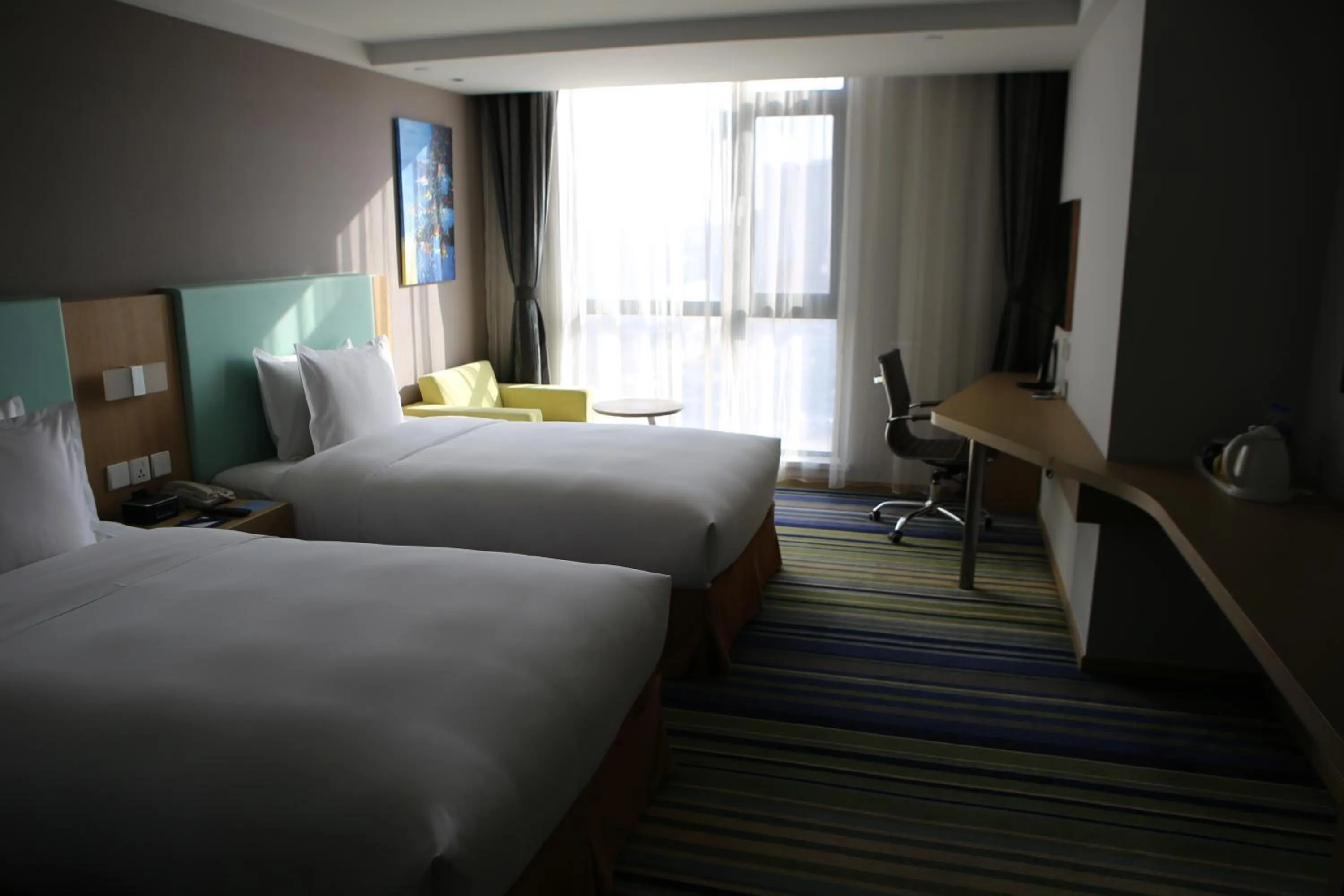 Bed in Holiday Inn Express Yingkou Onelong Plaza by IHG