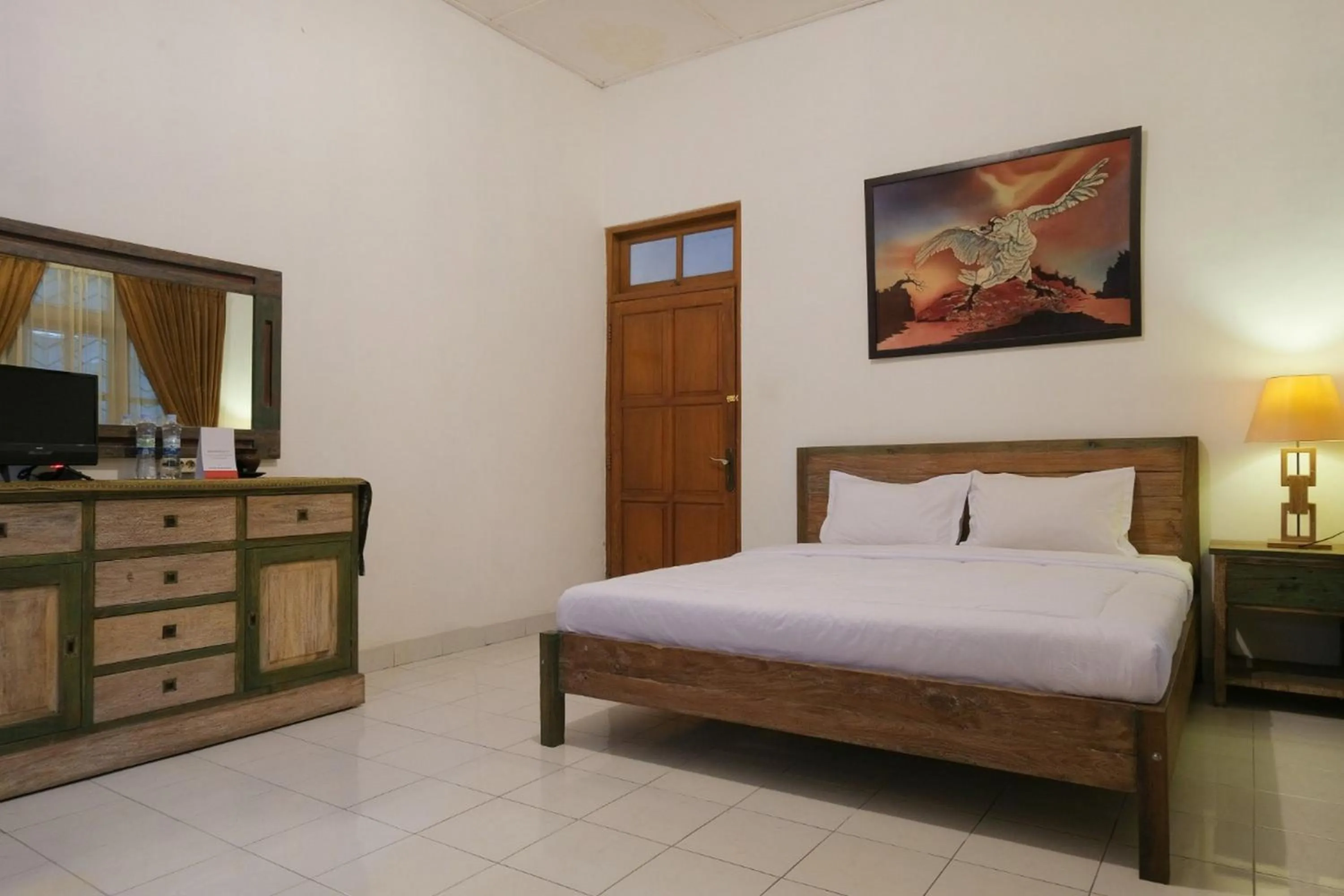 Bed in RedDoorz at Griya Cemara Homestay Yogyakarta