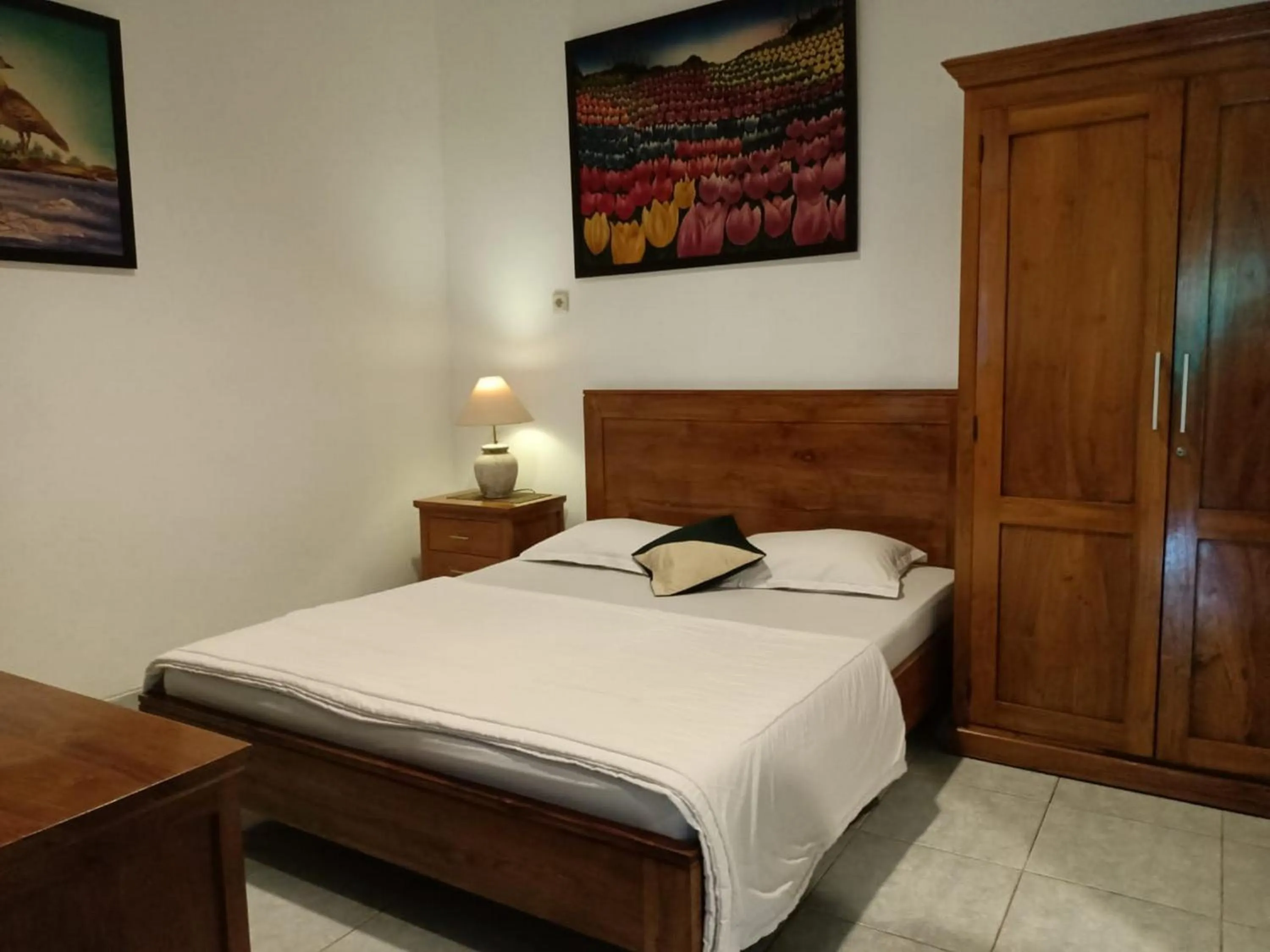 Bed in RedDoorz at Griya Cemara Homestay Yogyakarta