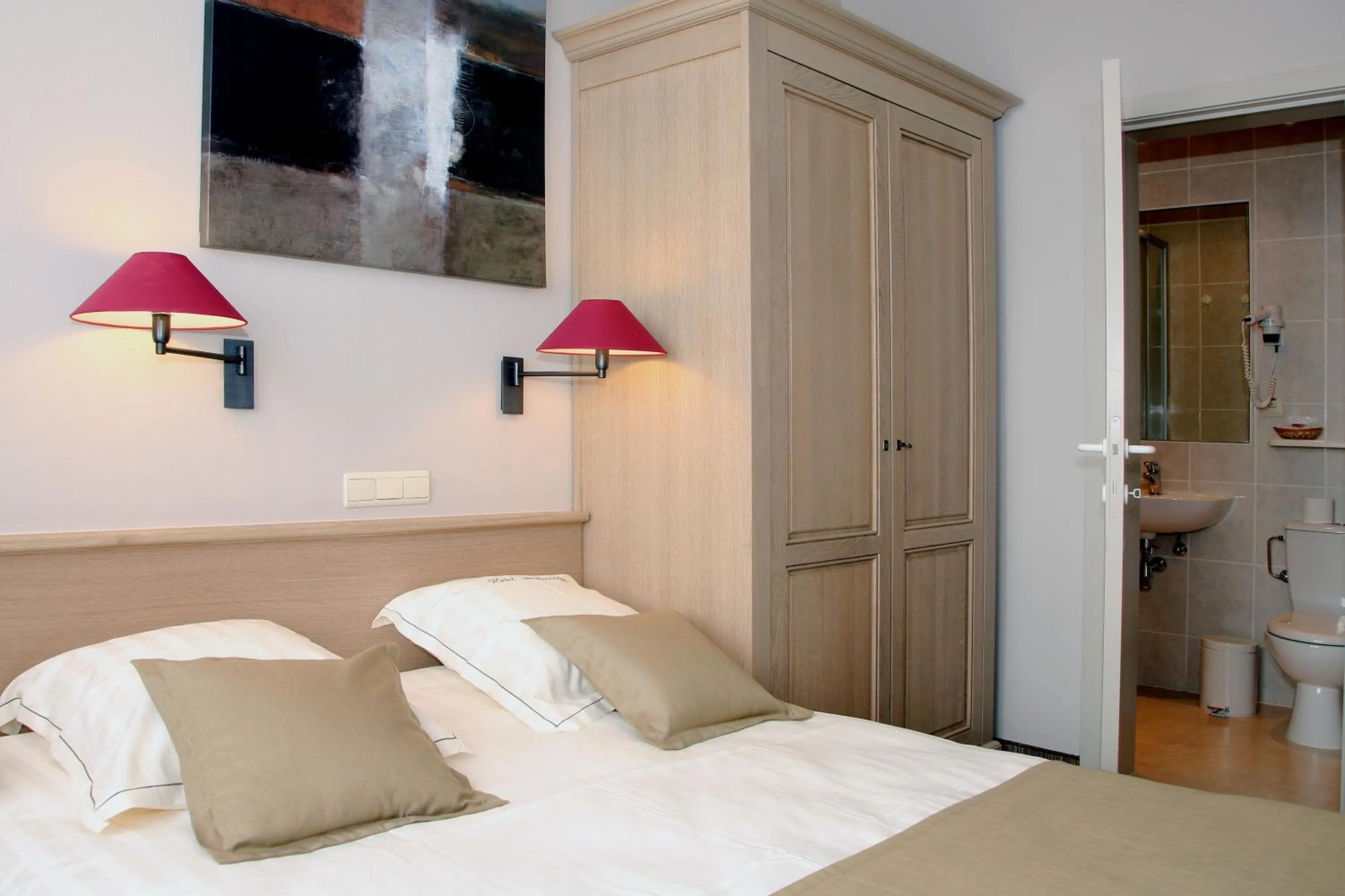 Bed in Ambassador Hotel