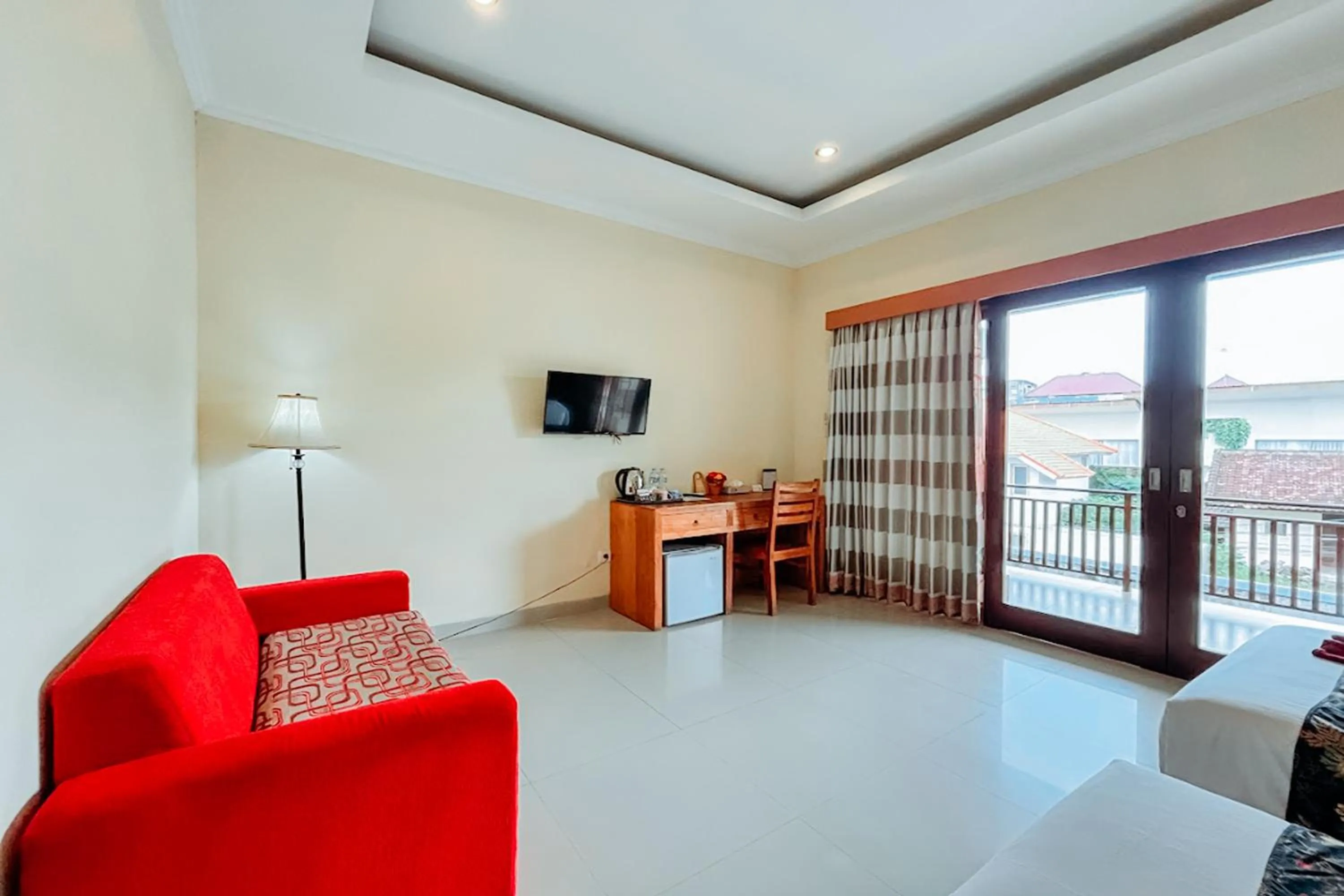 Communal lounge/ TV room in Kubu Petitenget Suite Seminyak