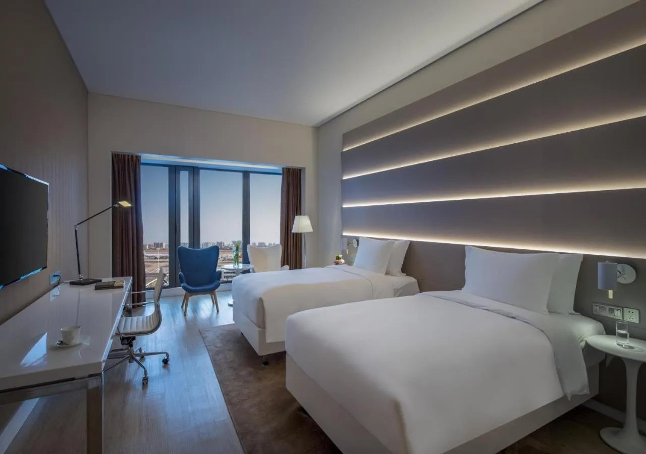 Photo of the whole room, Bed in Sanya Phoenix Airport Hotel