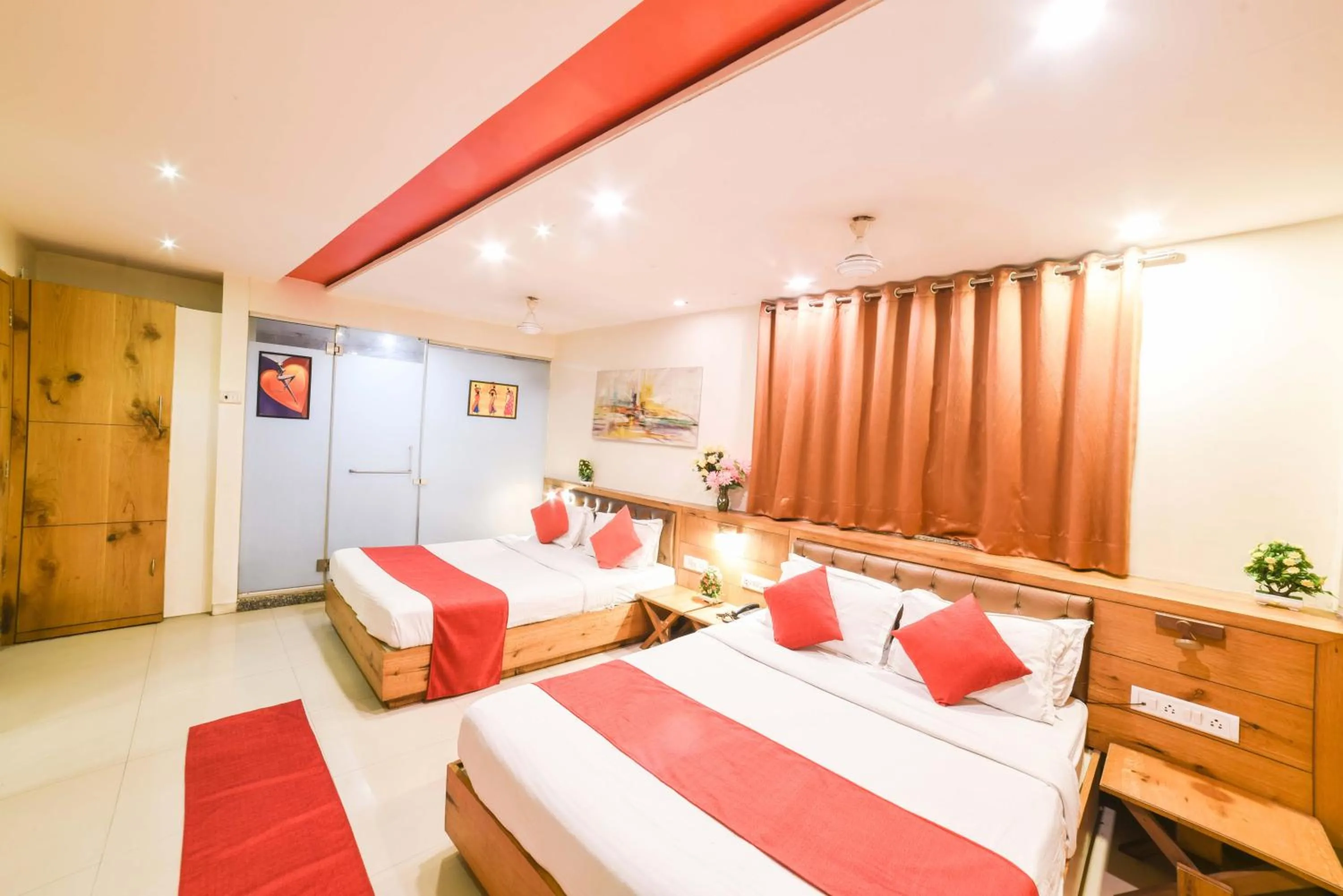 Photo of the whole room, Bed in Hotel Grandeur-Near Mumbai International Airport