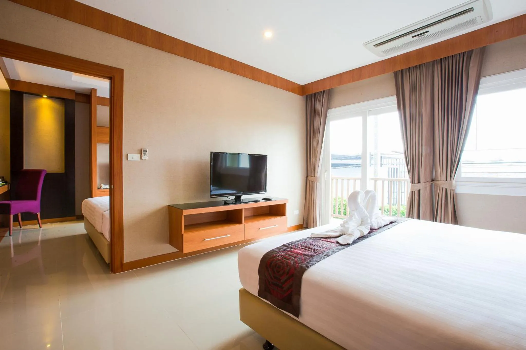 Bed in Romantic Khon Kaen Hotel