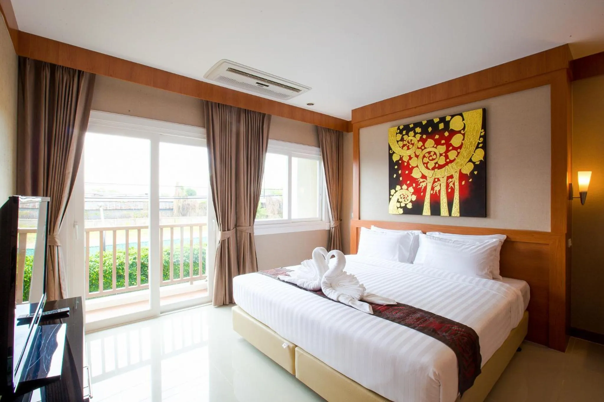 Bed in Romantic Khon Kaen Hotel