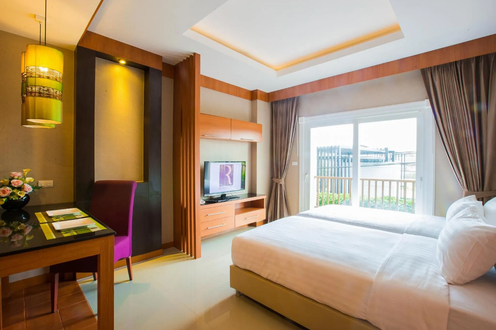 Bed in Romantic Khon Kaen Hotel