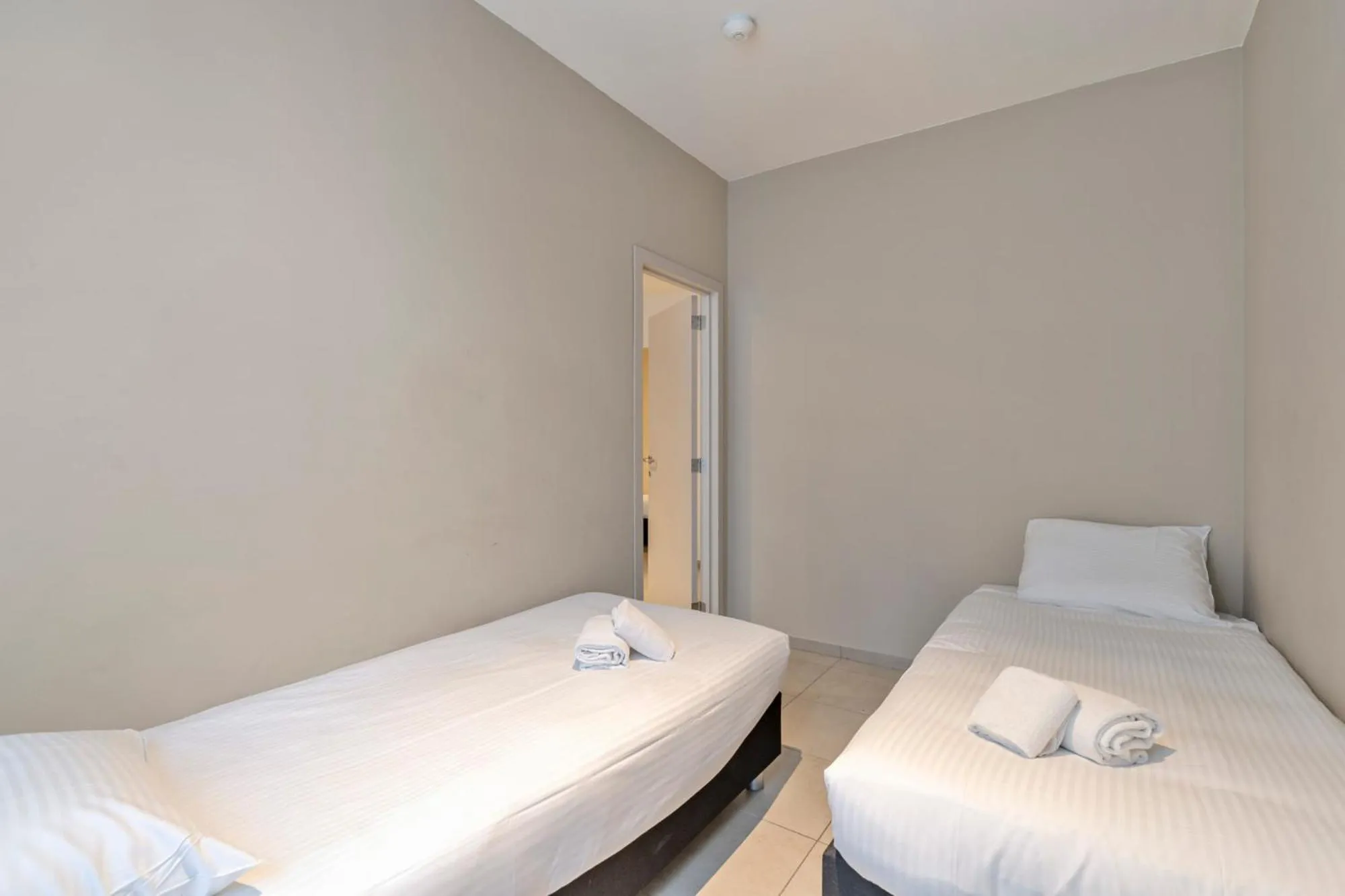 Bed in Ambassador Suites Leuven