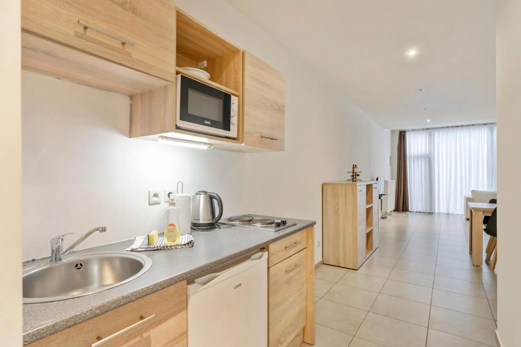 Kitchen or kitchenette in Ambassador Suites Leuven