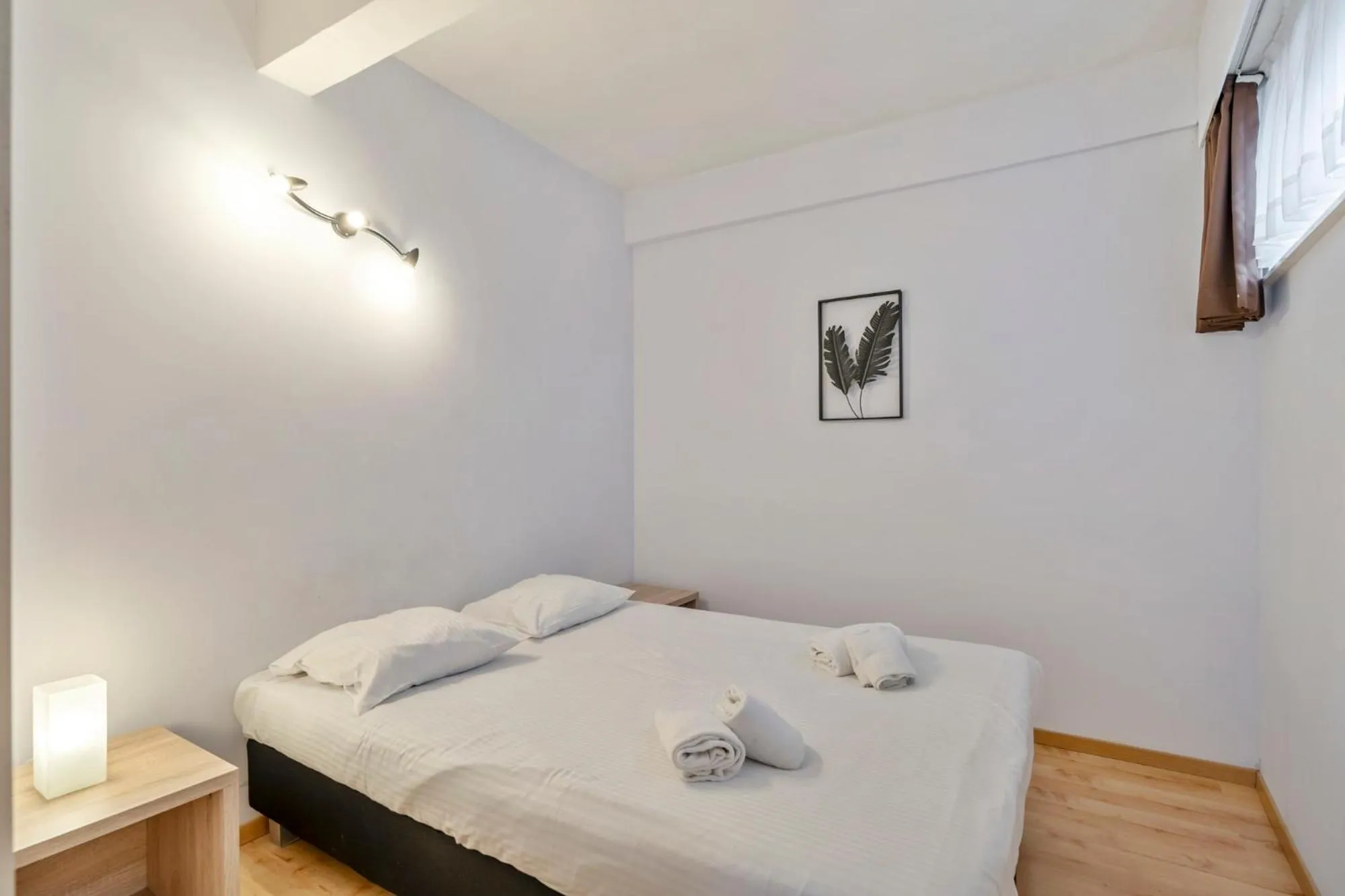 Bed in Ambassador Suites Leuven