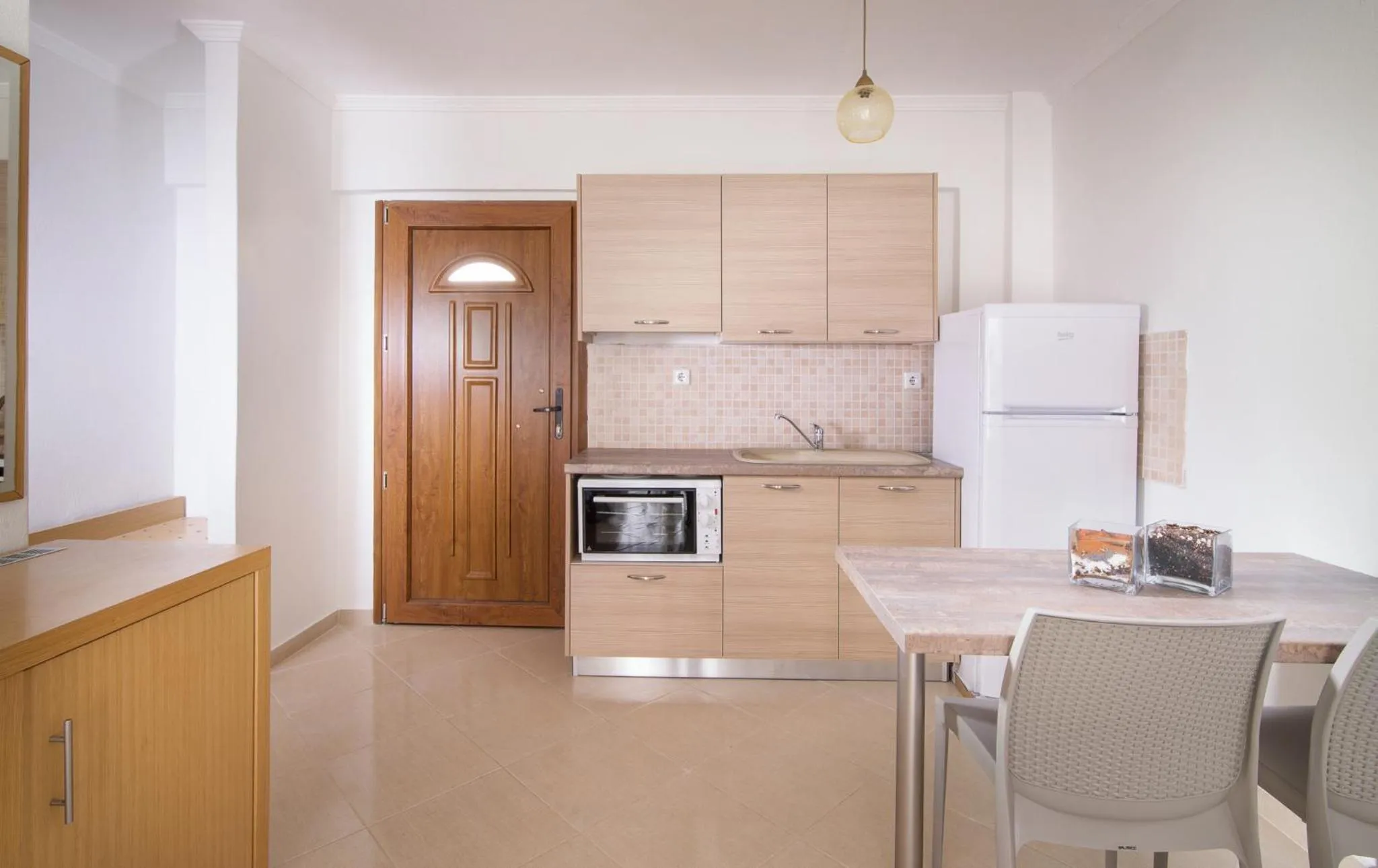 Kitchen or kitchenette in Apanemia by Flegra Hotels