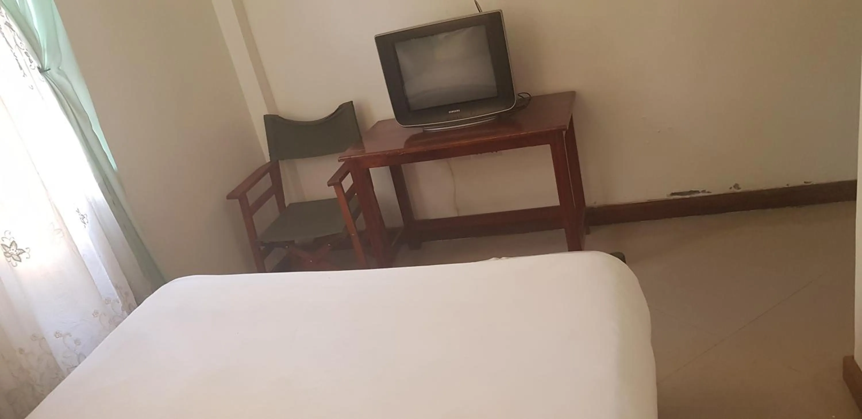 Bed in Bright Star Hotel & Safaris