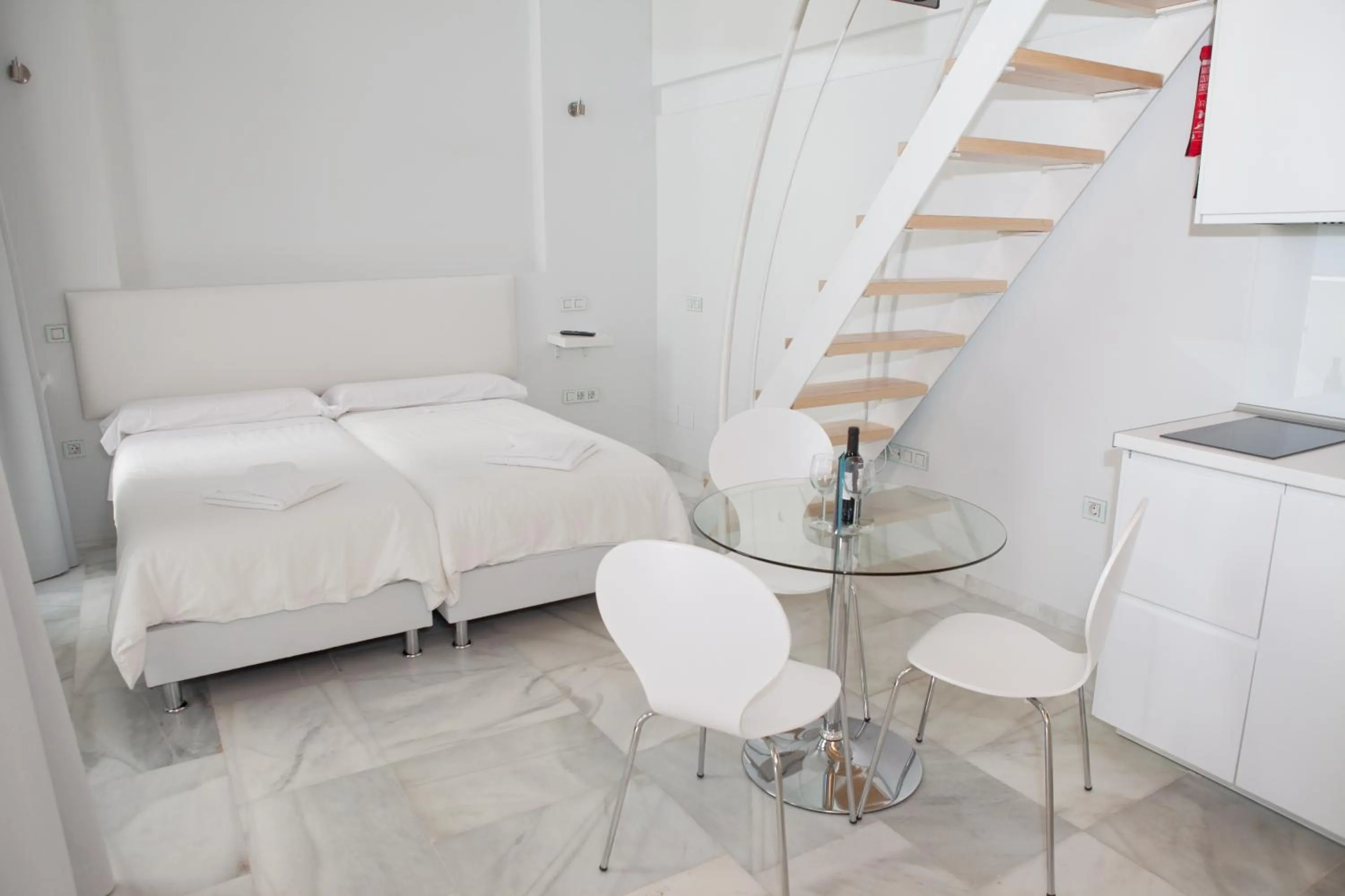 Dining area, Bed in Malaga City Breaks