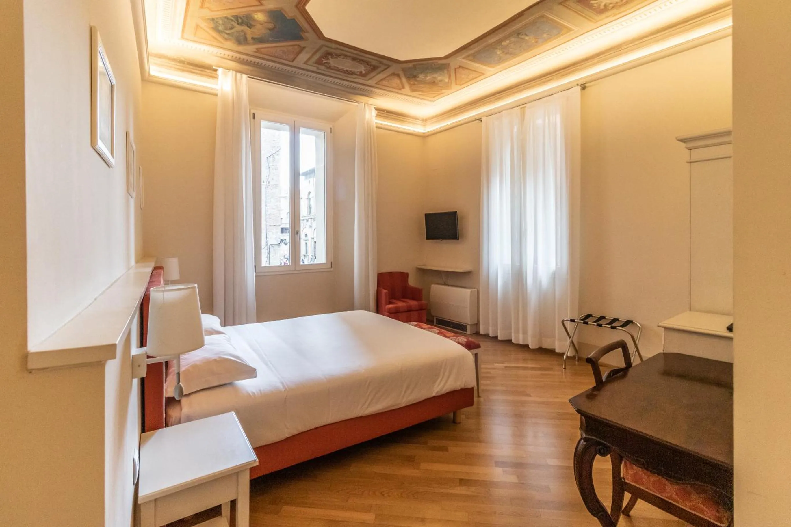Bed in Casa Isolani Luxury Rooms Piazza Maggiore 1