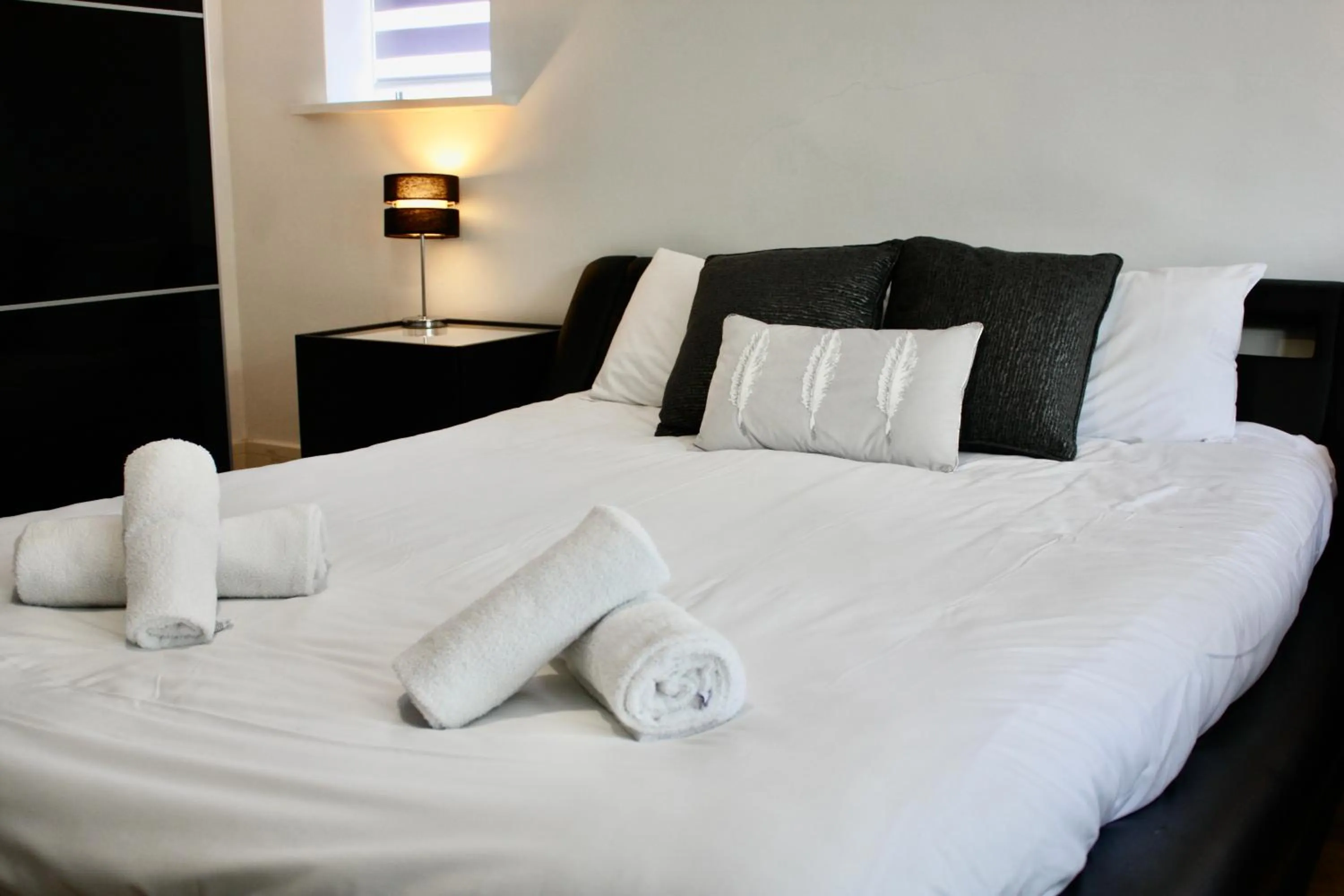 Bed in Four Corners Holiday Home Hot Tub & Sauna