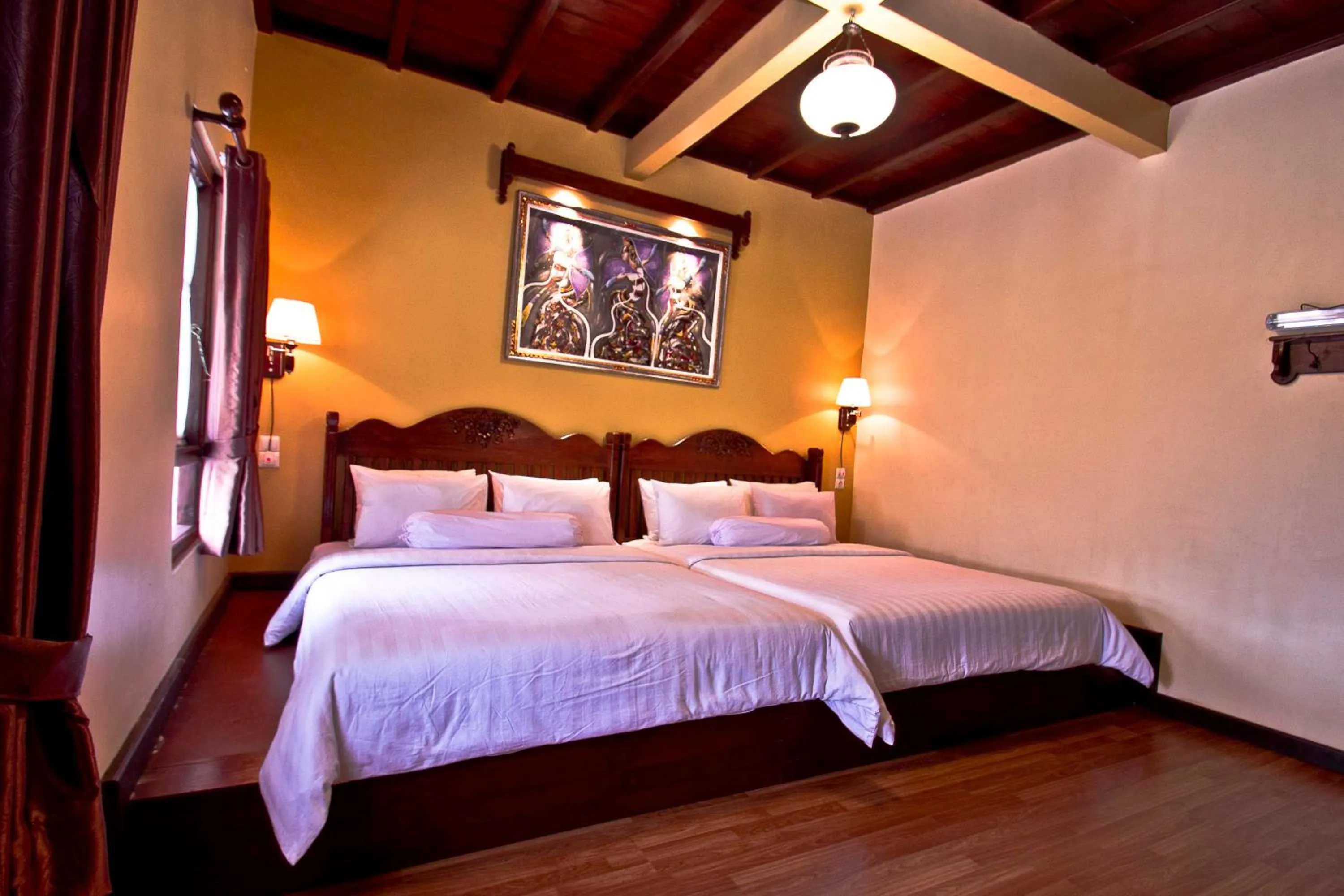 Bed in Puri Sakanti Nature Family Resort