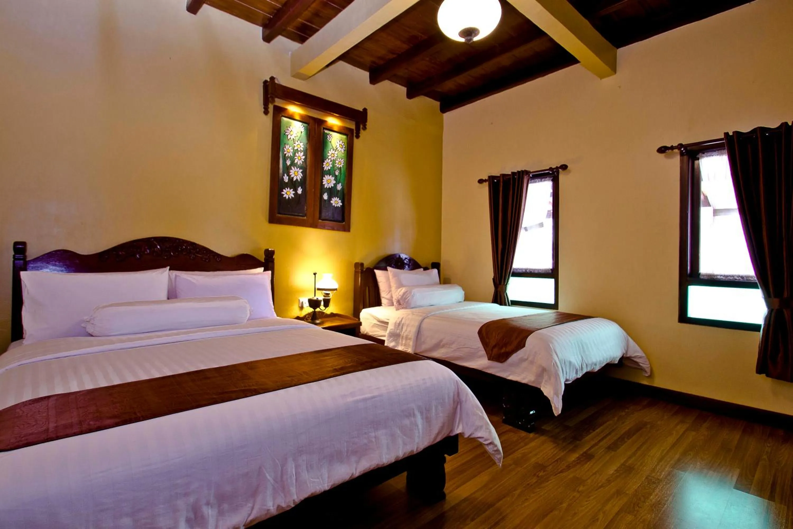 Bed in Puri Sakanti Nature Family Resort