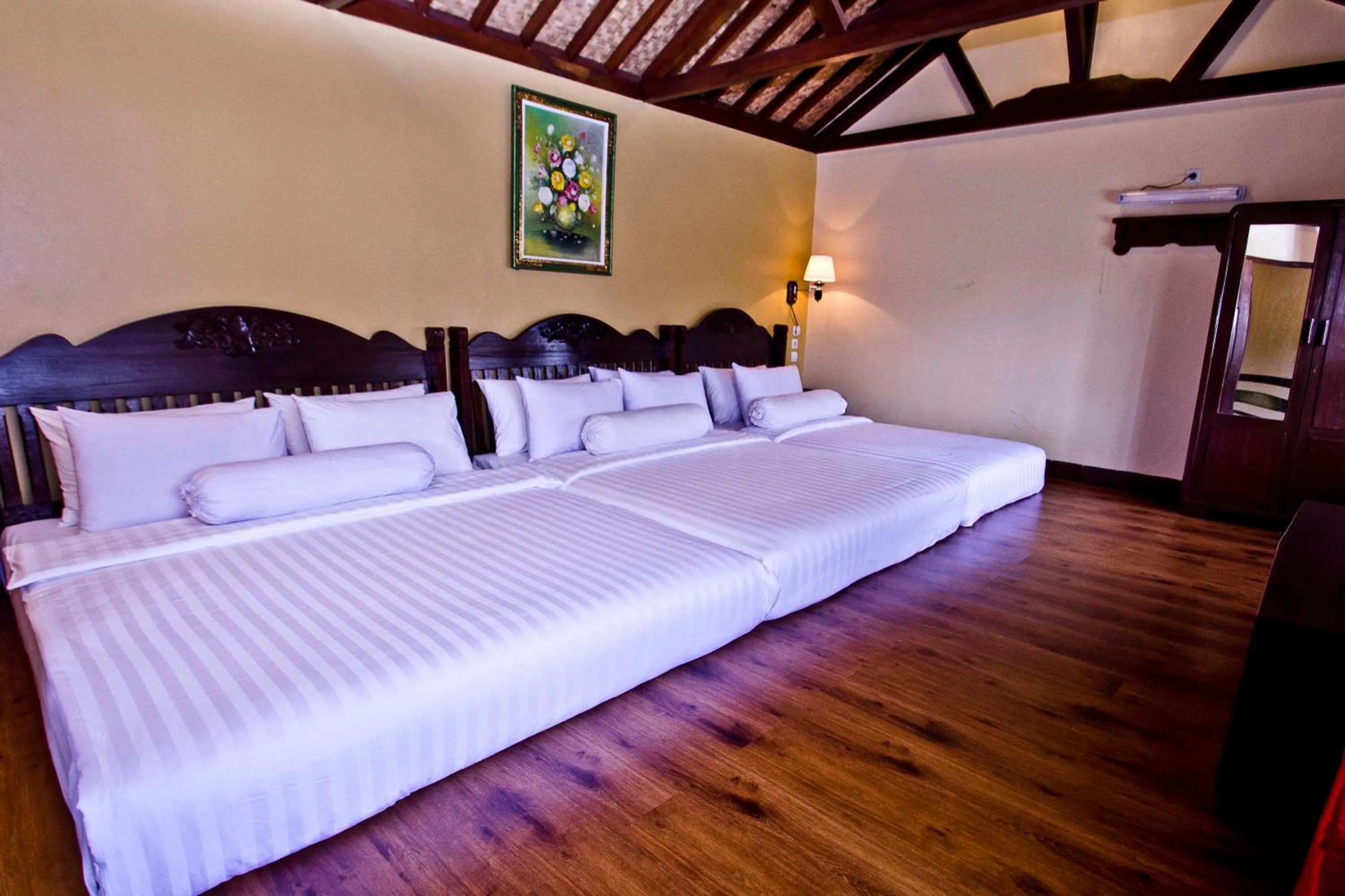 Bed in Puri Sakanti Nature Family Resort