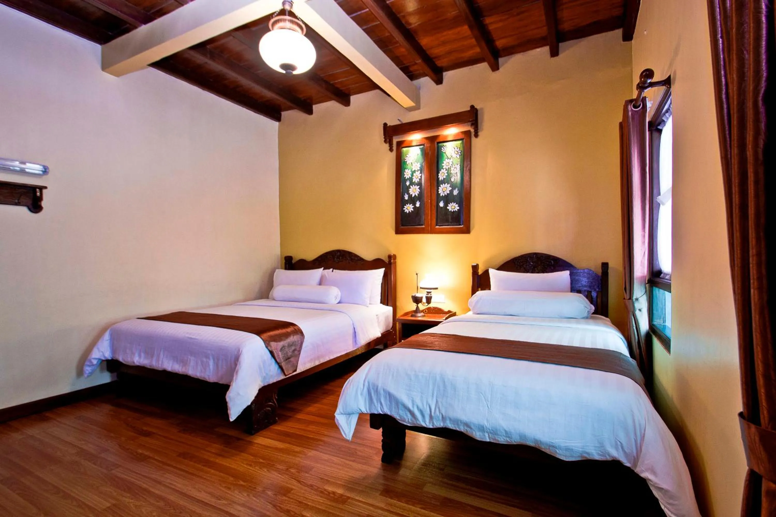 Bed in Puri Sakanti Nature Family Resort