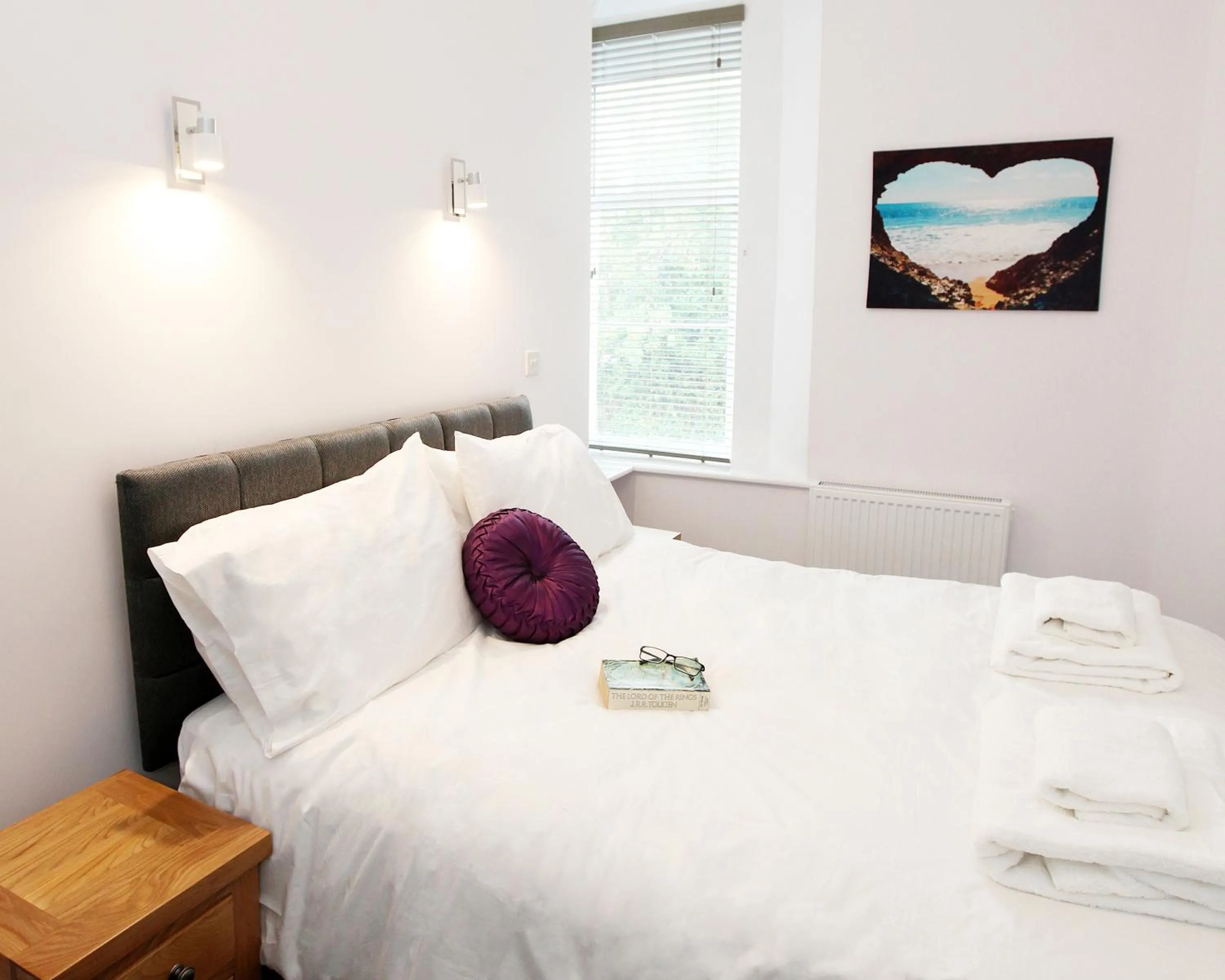 Bed in Austens Apartments