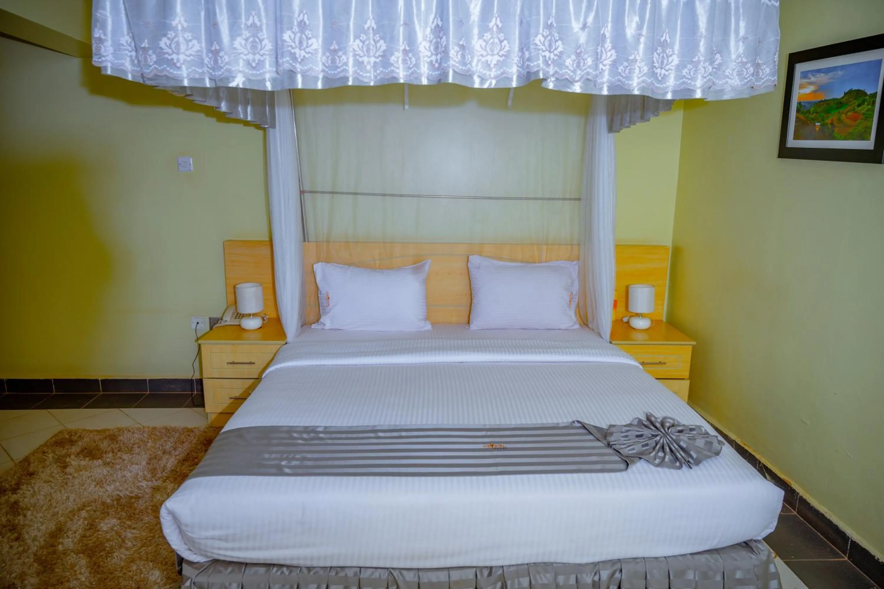 Bed in Crystal Suites & Apartments