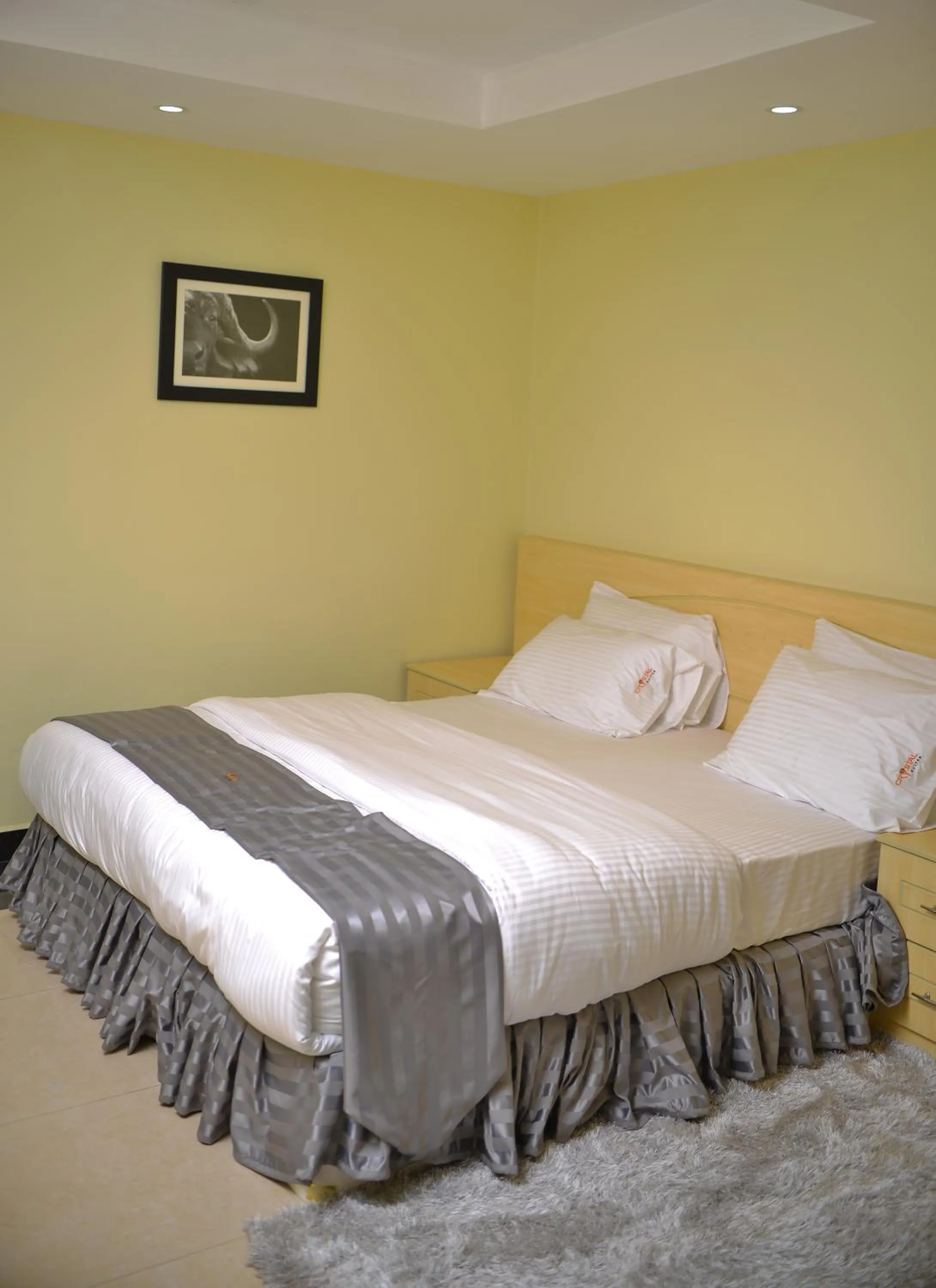 Bed in Crystal Suites & Apartments